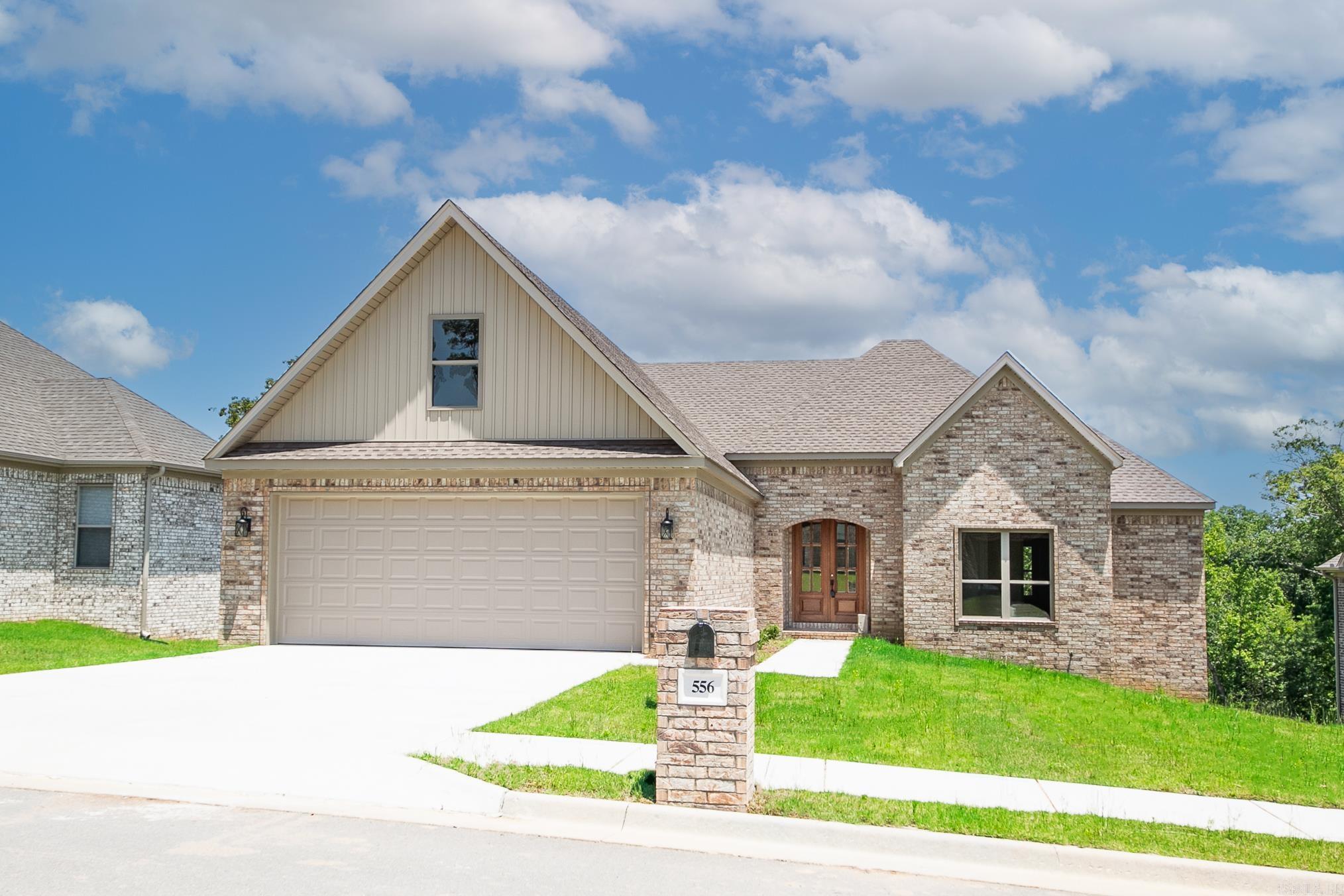 Beautiful new construction home on over half an acre!  Thoughtfully designed with double front doors that lead to a foyer which flows into the bright living room with vaulted ceiling, exposed beams, fireplace and open to the kitchen.  The kitchen has beautiful countertops and backsplash, stainless appliances & gas stove, walk in pantry, large island for prep & entertaining, under cabinet & kick toe lighting.  Three bedrooms downstairs with the 4th or large Bonus room up (has closet) & convenient 1/2 bath at bottom of stairs. The master suite has double sinks, walk in tiled shower, soaking tub, generous walk-in closet.  Laundry room is amazing with extra cabinets and folding counter.  Spacious garage.  Outside is a covered patio with attached deck overlooking the huge back yard.  Plenty of storage space under the house!