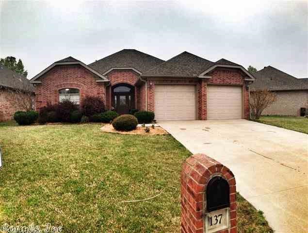 Warm & inviting describes this home, with top quality craftsmanship throughout.  No detail spared in this beautiful 3 bedroom, 2 bath + office.  With a large living & hearth room, this house is an excellent gathering place.  Large kitchen w/center island & lots of storage.  This home is loaded with beautiful trim work, plantation shutters and lots of crown molding.  Home is located on a quiet street with a greenbelt and walking path behind.