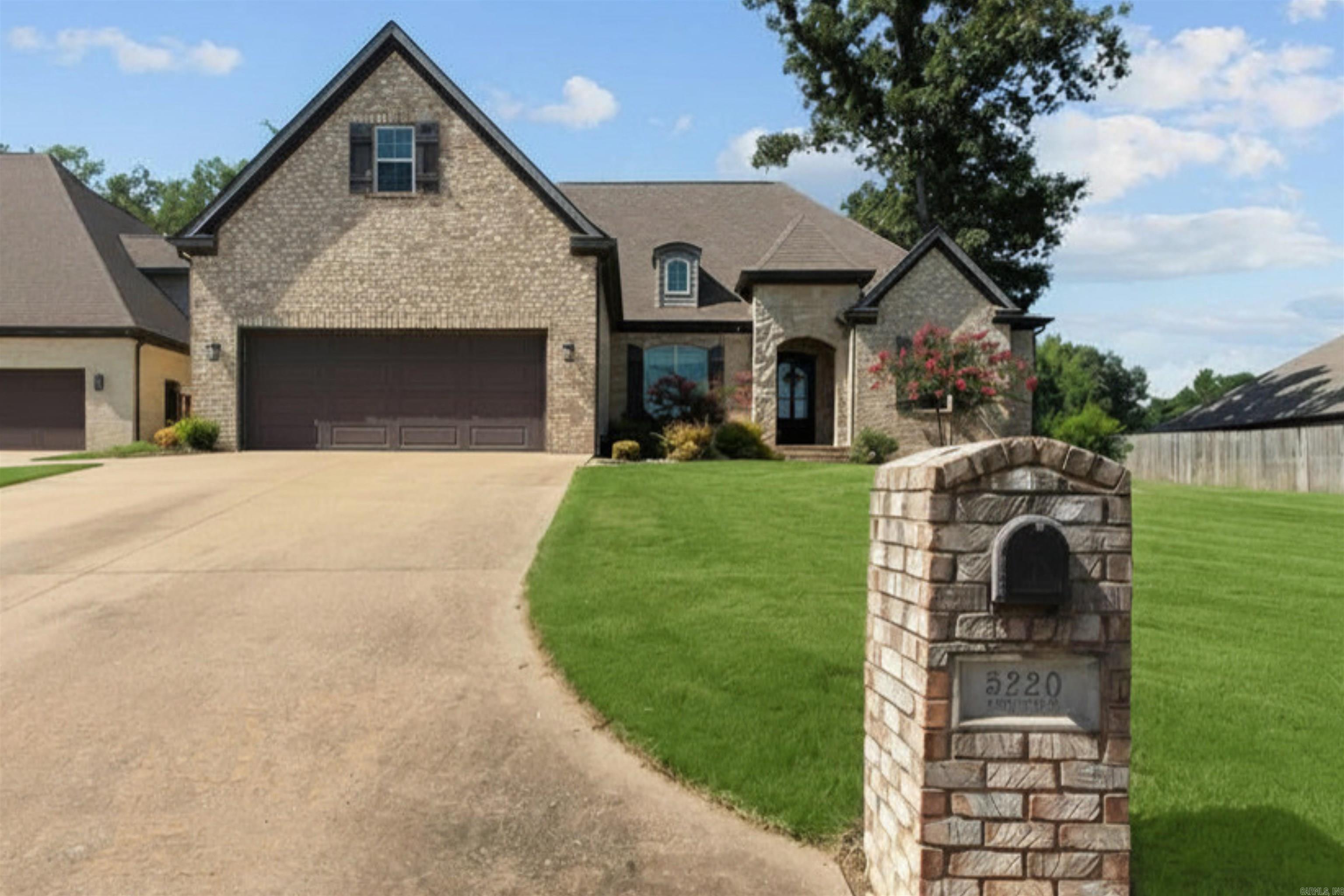 Welcome to 5220 Providence Circle, a home that feels brand new the moment you step inside. Built in 2014 and lived in only a few months out of the year, this 5-bed, 3.5-bath home shows minimal wear across 3,312 immaculate square feet.  Soaring ceilings and 8-foot doors set the tone, with top-of-the-line finishes throughout. The open kitchen and living area shine with coffered ceilings, built-ins framing the fireplace, and stone accents. A 9-foot island with granite counters, storage on both sides, and Frigidaire Gallery appliances anchors the space, while walls of windows overlook the enormous covered patio.  The private primary offers an oversized bedroom while the primary suite offers dual sinks, a soaker tub, oversized walk-in shower, and custom closet. Three more bedrooms and two baths sit on the opposite side, including one with a private bath that lives like a second suite. Upstairs adds an oversized bedroom, bonus room, and half bath.  Engineered hardwood, custom blinds, and a large laundry room with sink complete this pristine home. Schedule your private showing today and call this one HOME!