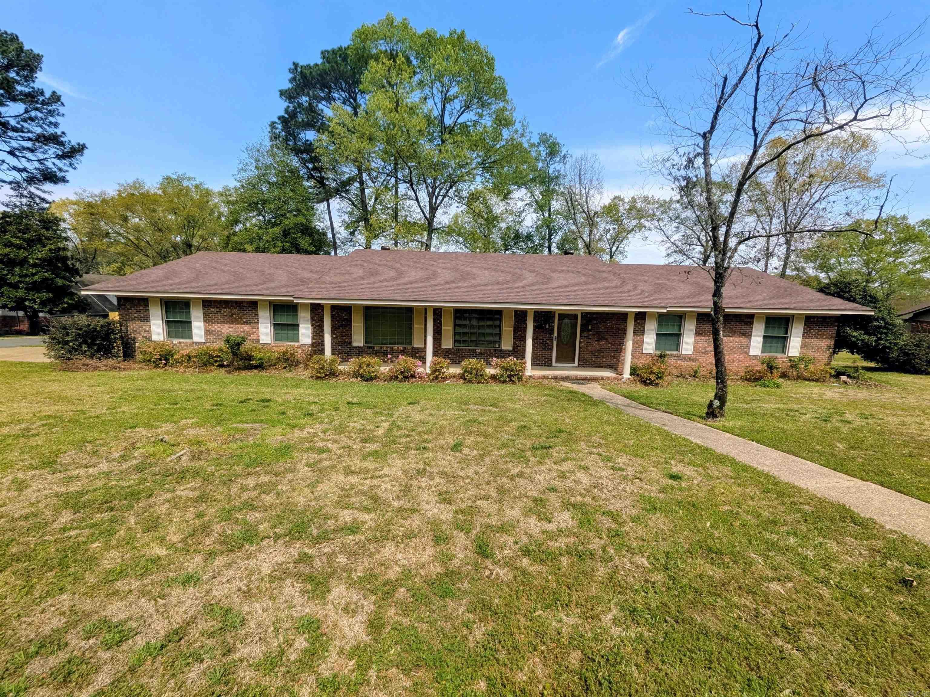 Beautifully renovated 3 BR/2 BA brick home! Every detail has been thoughtfully upgraded to combine style, comfort, & functionality. The heart of the home is the chef’s kitchen, featuring new appliances, a 6-burner gas stove, microwave drawer, butcher block countertops, floating shelving, custom cabinetry, copper hardware, a new sink, & tile backsplash & flooring. A mobile center island w/ storage underneath adds convenience & versatility, while built-ins & a large double-door pantry provide exceptional storage. The kitchen/dining area overlooks a large covered deck w/ a cathedral ceiling, along w/ a beautiful backyard complete w/ a privacy fence & 2 storage buildings. Inside, updates include wood flooring, fresh paint, & remodeled bathrooms. Enjoy spacious BRs w/ ample closet space & 2 living areas, offering flexibility for everyday living. The cozy family room features a custom fireplace w/ gas logs, while the living room includes an additional dining space. Additional highlights include new ceiling fans, LED lighting, & a sprinkler system for lawn maintenance, and whole-house standby generator. Square footage, lot size, and acreage is taken from courthouse records.