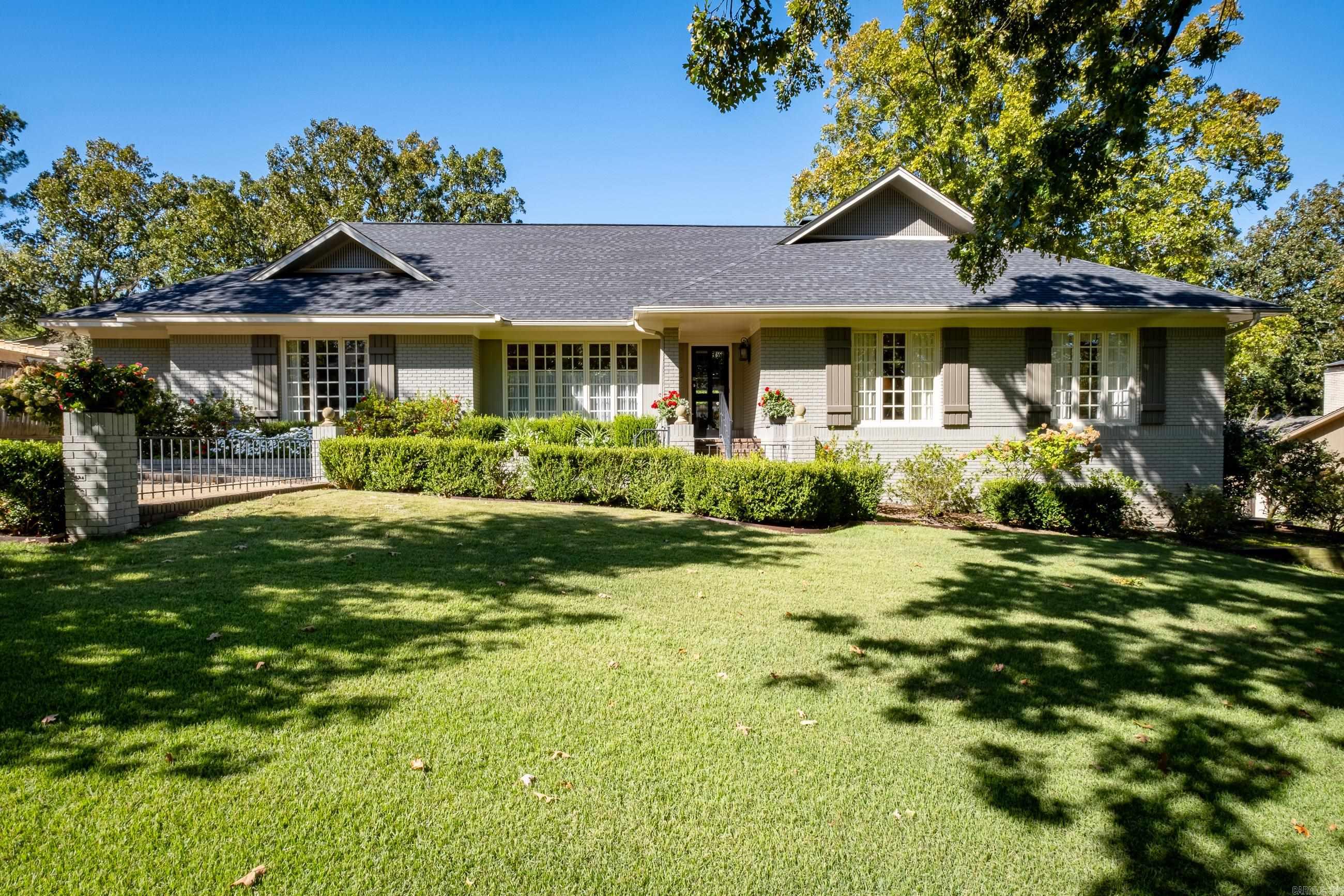 Exquisite one level Pleasant Valley/Longlea home with loads of updates, extras & a split floor plan! Large living room has vaulted ceiling, wood burning fireplace & large windows overlooking the deck & backyard. Large formal dining rom. The kitchen has been updated w/ quartz countertops, stainless steel appliances, double ovens, large pantry, island & leads to a lovely bkft/morning rm w/vaulted ceilings. The master bedroom nicely sized w/windows that provide plenty of light. The master bath has been updated w/a separate jetted tub, steam shower, heated floors, 2 vanities & a large closet w/a separate cedar closet. 2 bedrooms w/a bath on one side of the house & a bedroom & bath on the other. Hardwood floors along w/ carpet in some bedrooms. The backyard has a large deck w/ a portion that is covered, in ground pool & impeccable landscaping. Garage is rear loading w/ a hobby room including a sink. Large under house storage has poured concrete floor. Interior stairway leads to unfinished attic w/ approx  600 SQFT, ideal for a game room finish out. Fresh paint inside and out. 3 year old roof, newer HVAC.