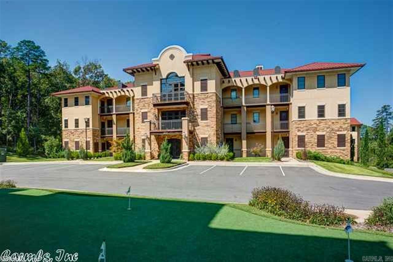 This top floor condominium offers vaulted ceilings and fabulous views of Chenal Valley's golf course.  It features custom detail that makes living simple yet luxurious.  Hardwood floors, carpeted guest bedrooms.  Kitchen with stainless steel appliances and slab granite countertops.  Breakfast bar plus dining area.  Includes two covered balconies one that includes a storage closet.