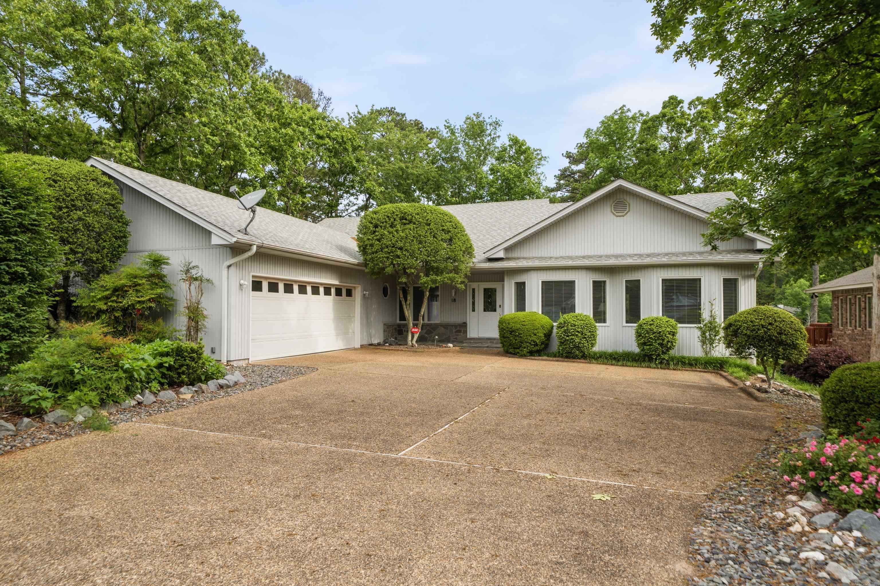 Wake up to sweeping golf course views from this beautifully updated Balboa Golf Course home in Hot Springs Village. Perfectly positioned on the 17th fairway, this spacious 4-bedroom retreat features soaring ceilings, walls of windows, and a unique walkout lower level offering exceptional versatility for guests, private work spaces, or luxury recreation. Seamless indoor–outdoor living invites effortless entertaining and relaxed resort-style living. Enjoy morning coffee on the covered patio, evenings by the fire, and the convenience of a flat driveway and 500-gallon buried propane tank. Extensively improved since prior ownership with updated flooring, fresh paint, quartz counter tops, cabinet hardware, premium blinds, smart ceiling fans, outdoor light fixtures and more. With furnishings available to convey, the home can be enjoyed immediately as a fully curated retreat. Just minutes from multiple championship golf courses, lakes, trails, fitness amenities, and dining, this property delivers an exceptional blend of comfort, scenery, and refined resort-style living—ideal as a full-time residence, luxury second home, or weekend escape.