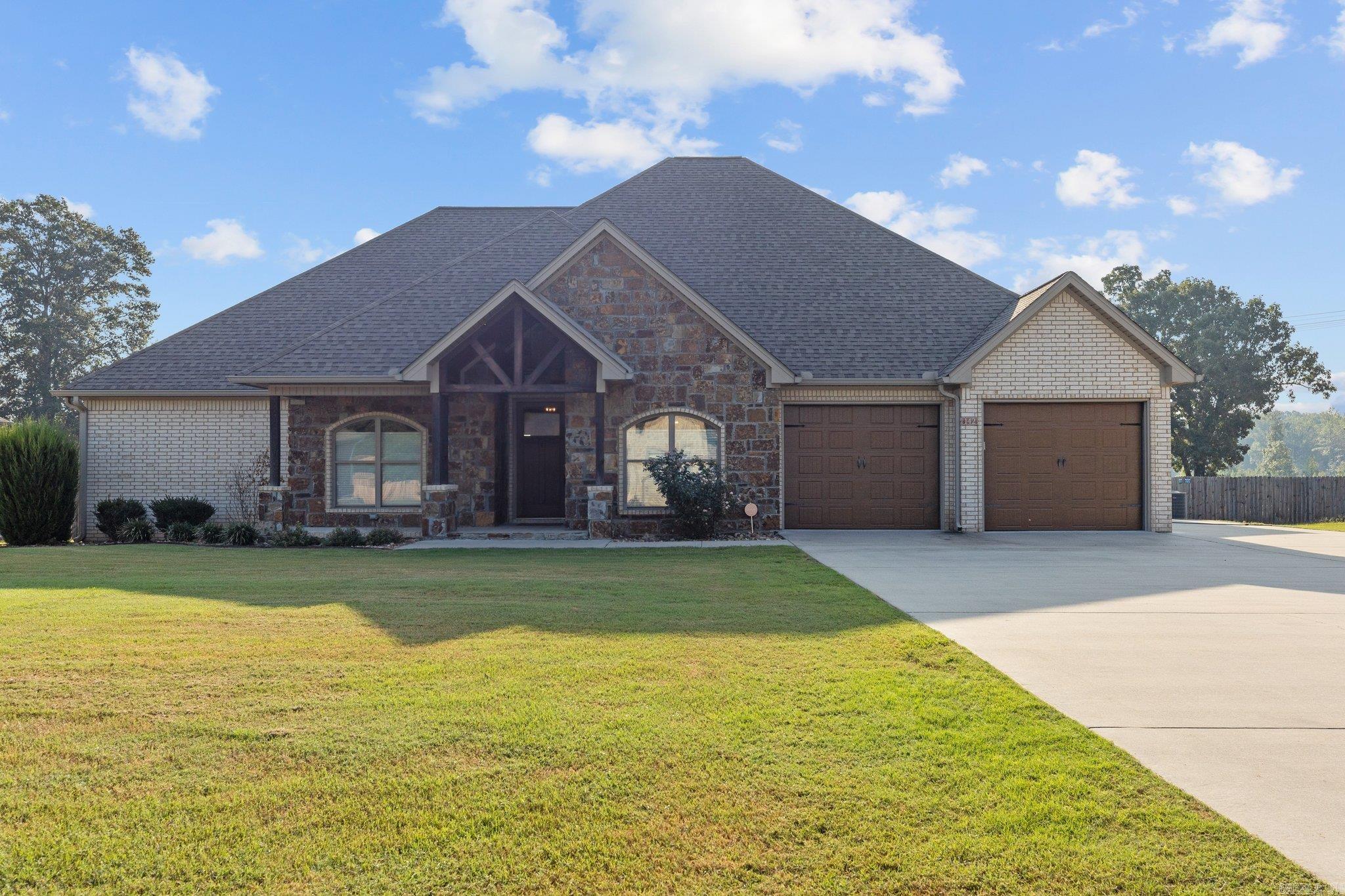 Brick & stone home with pool in Oak Tree Ridge subdivision, Sheridan Schools. 4 BR 3 BA plus large extra room that could be 5th bedroom, office, nursery or workout room. Floorplan is great for large family or work at home with lots of options for 2 offices plus guestroom. 2557 sq ft heated and cooled, on .66 acre lot, very nicely landscaped and maintained. Pool, extra storage building and 2 car garage. Large wood-look tiles throughout, so very nice!