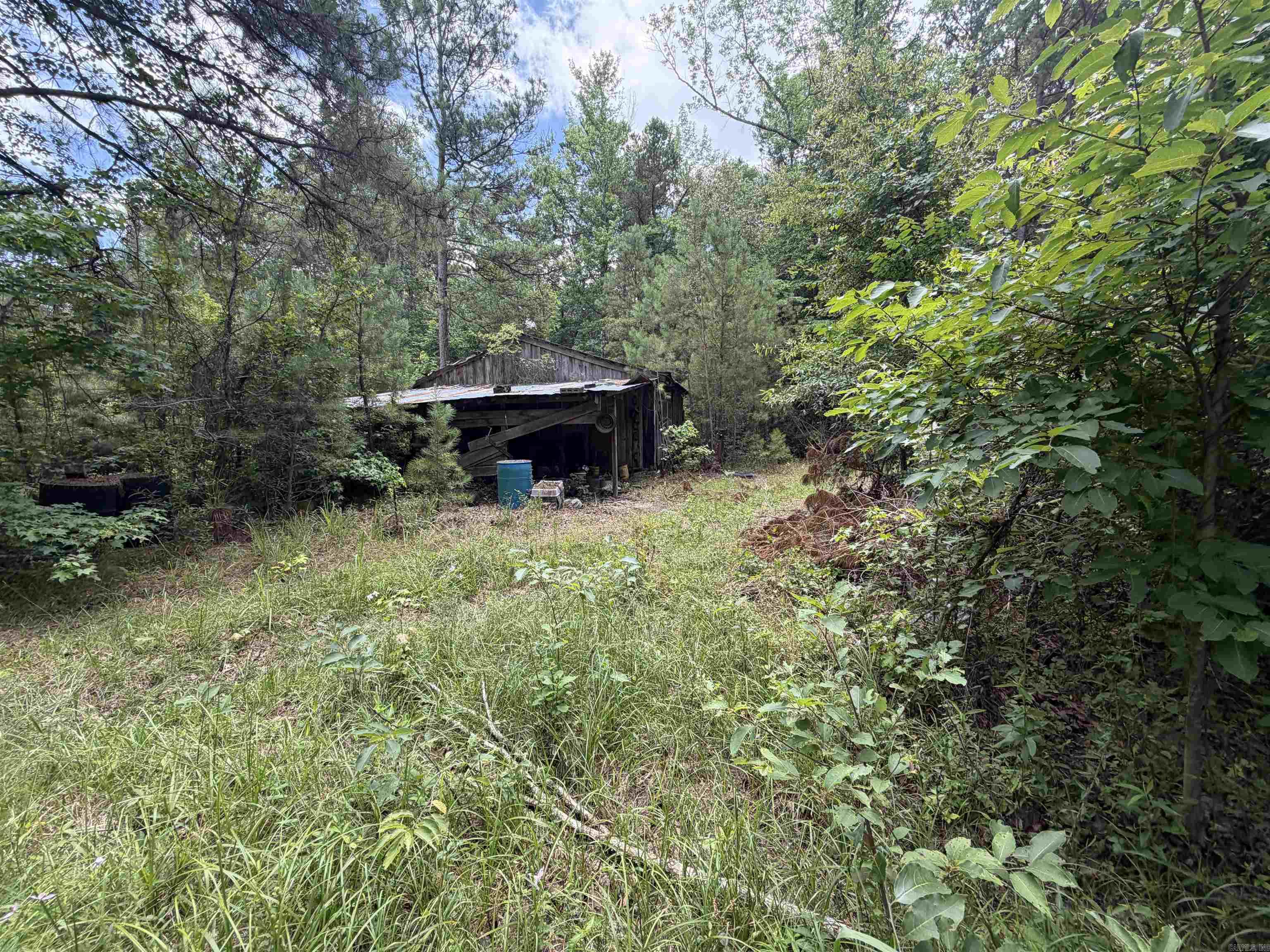 2 Acres with Trailer, Outbuildings, and Convenient Access to Outdoor Recreation Situated on approximately 2 acres, this property offers a mix of mature trees and open areas with a variety of potential uses. The property includes an existing trailer and two storage sheds. The trailer may be suitable for renovation or could provide an opportunity for future replacement, subject to buyer verification and local requirements. The acreage provides space for a homesite, recreational retreat, or investment property. Existing outbuildings offer additional storage for equipment, tools, or outdoor gear. Conveniently located near Big Timber public hunting land, the property provides easy access to outdoor recreation. An Ouachita River boat ramp is located less than 3 miles away, offering opportunities for fishing, boating, and river access. Property features include:     •    Approximately 2 acres     •    Existing trailer on site     •    Two storage sheds     •    Combination of wooded and open land     •    Nearby public hunting access     •    Less than 3 miles to Ouachita River boat ramp Buyer is responsible for verifying acreage, condition of improvements, utilities, restrictions, and in