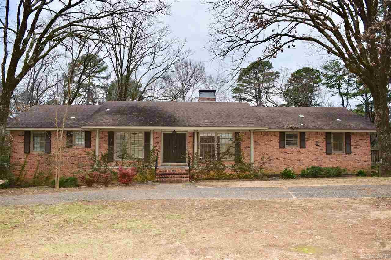 On 2+ acres there's privacy for this Brick Family Home that lives like a 1-level! Double doors lead from front porch to tiled entry. Beautiful hardwoods on main level-Living Room w/FP, Den, Dining w/bay window. Sunroom/office. Laundry. Updated kitchen has granite counters, tile backsplash, center isle w/small 2nd sink, opens to Breakfast room. 2 1/2 baths & 3 Br including master on main level - 2 Br & bath down+HUGE Living area with 2nd FP -ideal for in-laws! AS IS AT THIS PRICE