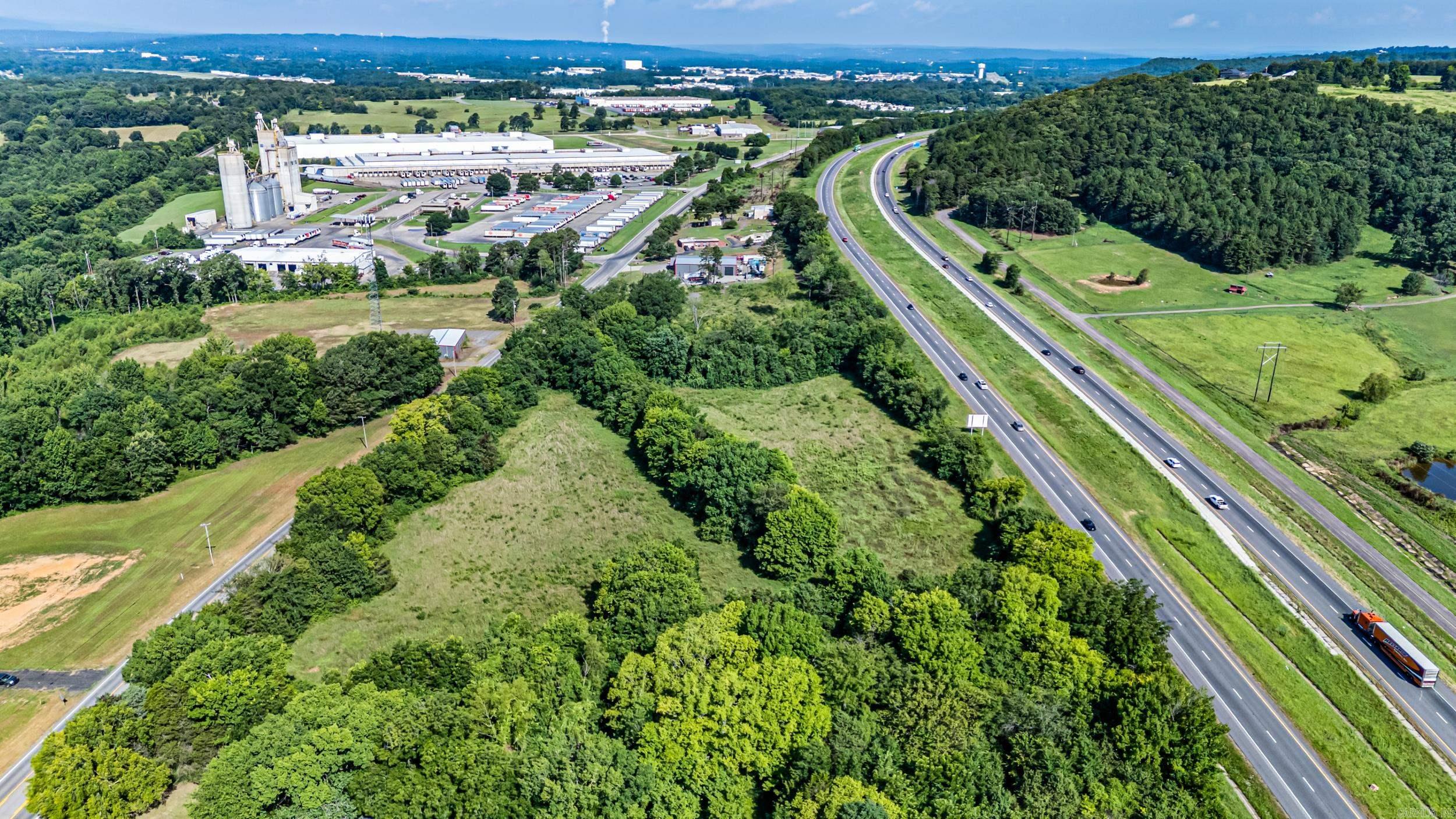 Exceptional Commercial Development Opportunity!  This 7.11-acre commercial tract is strategically located between Interstate 40 and Highway 64 in Pottsville, offering outstanding accessibility and a prime location for future development.  Zoned C-3, the property is well-suited for a variety of commercial uses, including retail, office, restaurant, hospitaility, industrial, or service-related businesses. With ample acreage and excellent potential, this tract provides the space and flexibility to accommodate projects of many sizes.  Whether you're expanding your business or investing in commercial real estate, this property offers endless possibilities in a highly desirable location.