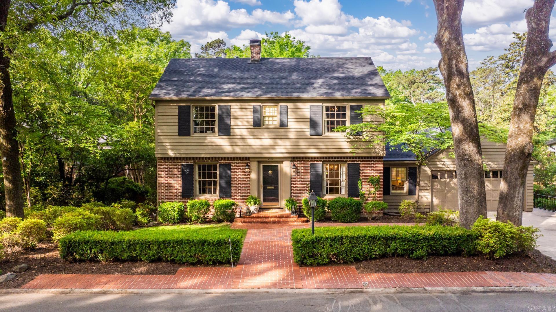 This is a timeless 4 Bed 3.5 Bath with a brand new roof in the Forest Park school zone of the Heights.   Backing up to some gorgeous protected greenery - The charm starts here, being wrapped with blooming white azaleas and a variety of dogwoods and magnolias under a canopy of mature oaks.   Inside: To the left is the 1st of your 2 living rooms with the fireplace & double doors to your covered deck, overlooking your flat and fully fenced yard that backs to protected greenery.   To the right is the office or dining that opens nicely to your immaculate large living with floor to ceiling bay windows, a second fireplace set between stately library style built ins, and a convenient half bath nearby.   Your kitchen features granite counters with granite splash, exposed brick accents, and access to your additional office area.   Privately set apart on the main level is your spacious raised ceiling primary suite with dual doors to your bath that has the walk-in shower.   Take the stairs to find your additional 3 guest beds & 2 baths, including the oversized in-law suite with great natural light and beautifully updated vanity with the walk-in shower.