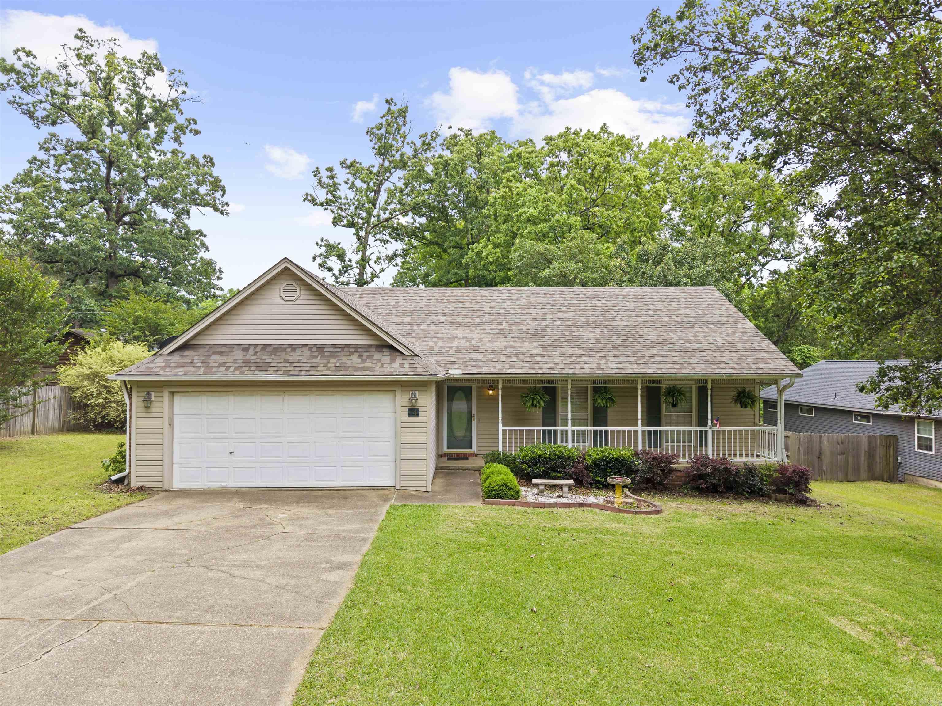 New paint and new flooring! Right off of Northshore. The front door leads into your living room, complete with a fireplace and access to the back deck.  The eat in kitchen combo utilizes space and efficiency, while letting in tons of natural light.  Your bedrooms are situated down the hall, away from the main living area.  Don’t miss the garage or extra storage shed!