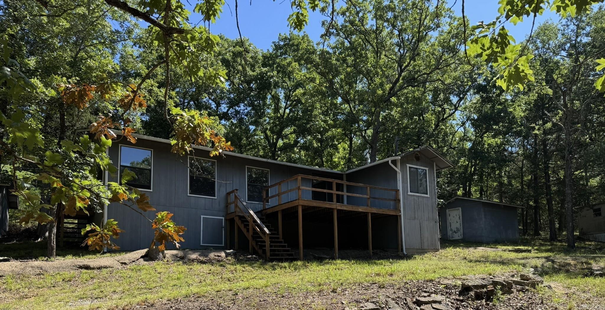 Escape to your own slice of paradise with this delightful 2-bedroom, 2-bathroom lake cabin nestled just a stone’s throw from the shores of Bull Shoals Lake. Perfectly situated bordering the Corp. Land, this property offers lake views and is just a few minutes away from convenient boat launch lake access. Whether you’re looking for a weekend getaway or a year-round residence, this cabin is the perfect retreat for those seeking tranquility and outdoor adventures. Don’t miss out on the opportunity to make this dream home yours!