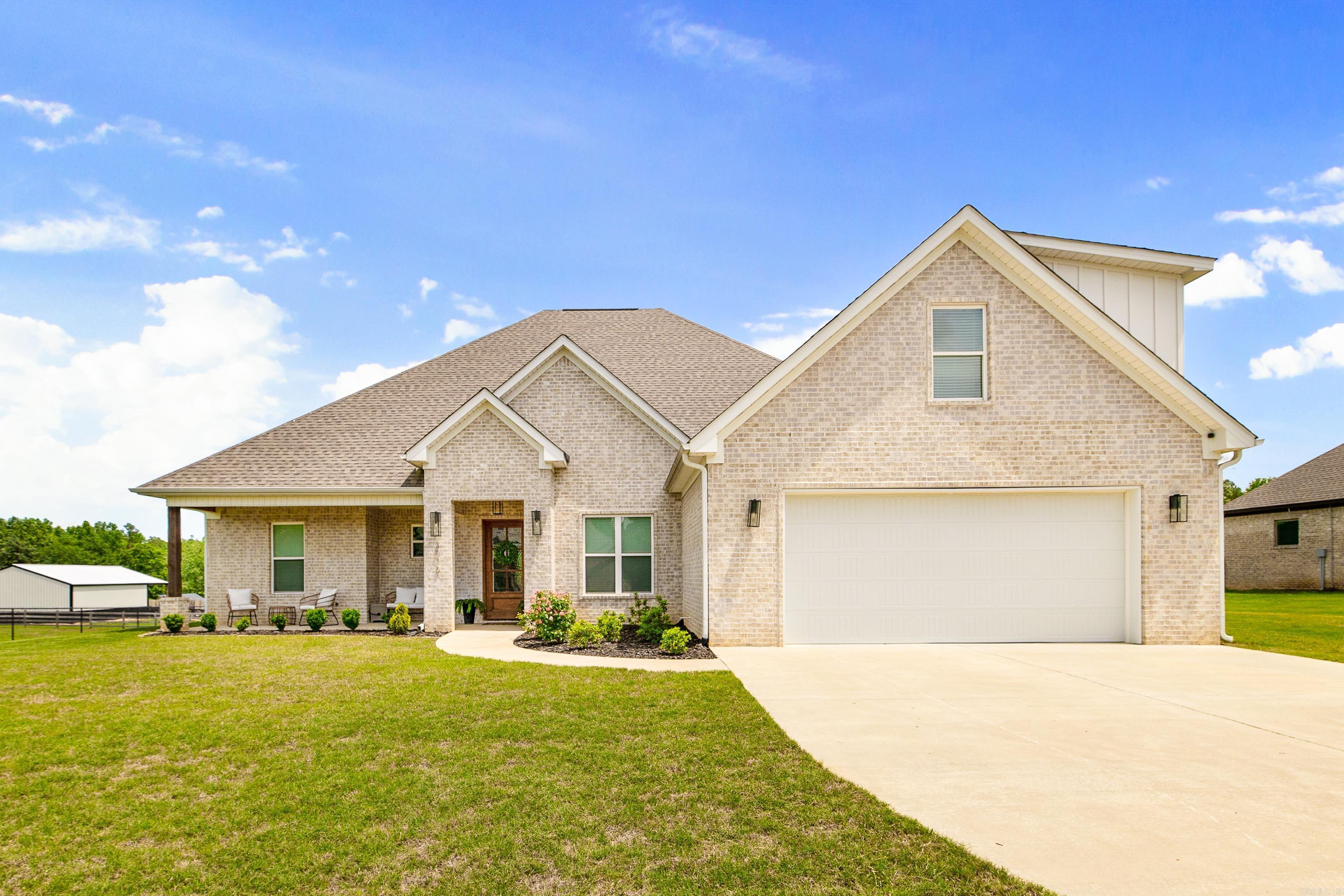 There’s something special about a home where life naturally slows down a little. Where neighbors enjoy evening walks, gathering outdoors, and genuine connection that feels harder to find these days.  Set on a level, cleared one-acre lot in a quiet Bryant School District subdivision, this property gives you space while still being connected to everything you need.  The heart of the home invites connection — from cozy nights around the fireplace to slow weekends in the kitchen. Sunlight pours through large picture windows while the open layout creates space to entertain effortlessly still feeling comfortable and personal. Every detail, from the hardwood floors, 8 foot solid doors to the floating shelves and built ins, were designed to feel elevated yet welcoming.  The primary retreat is an escape at the end of long days — a quiet place to recharge with a soaking tub, walk in shower and oversized custom closet. Upstairs offers flexibility for guest, second living space, or changing lifestyle needs, while the office creates room for productivity. More than just a beautiful home, this is a place where memories are made and community still matters. Showings start June 4th!