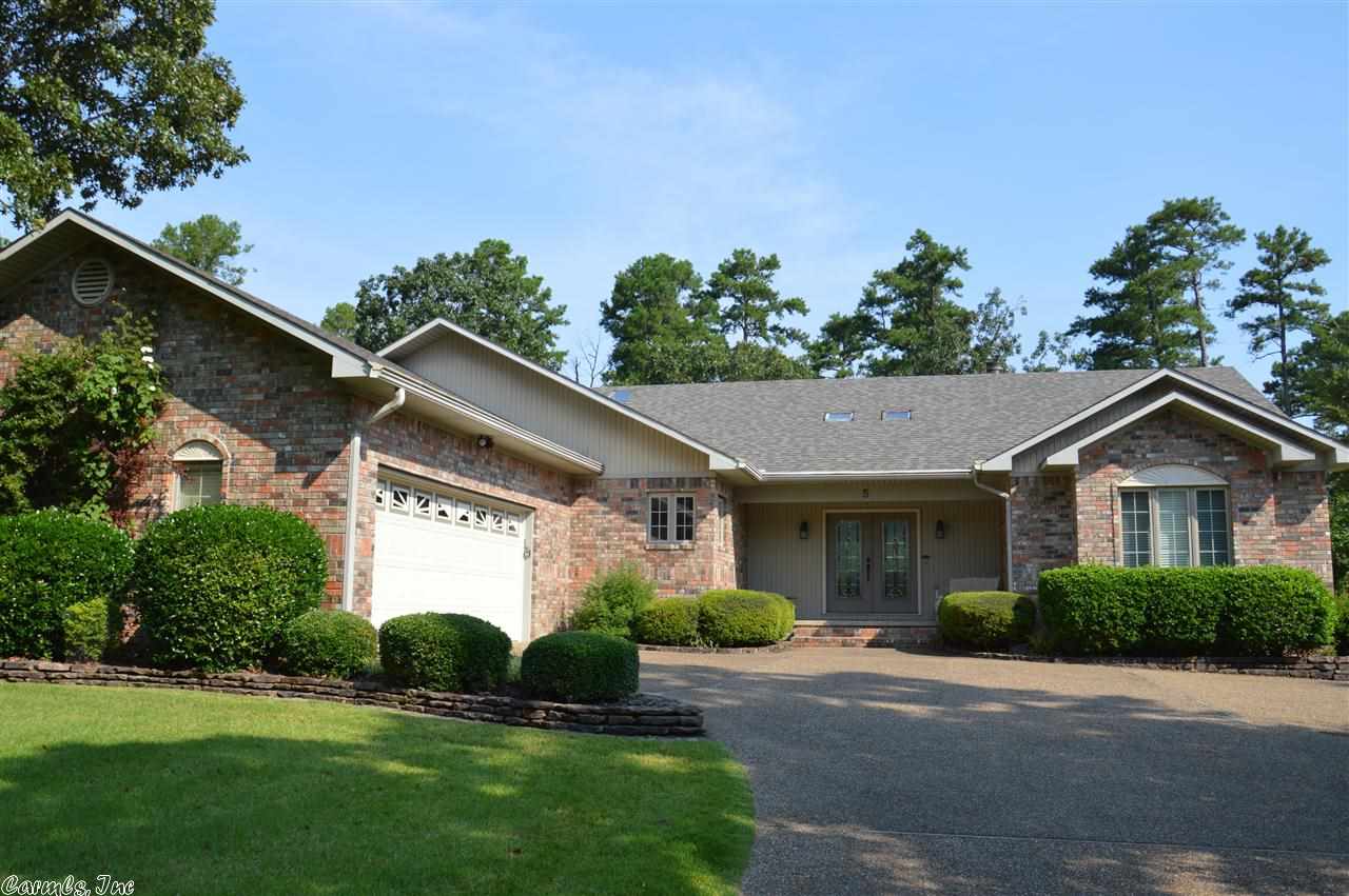 The 13th green and fairway features this Spectacular one level home with a split floor plan! Dining Area, Arkansas Room, Office off Master, and Beautiful Landscape are just a few of the extras you'll find with this one! This immaculate home is Freshly painted and has beautiful hardwood floors along with a Spacious kitchen with a lot of Counter Space and Cabinetry! A Vaulted Living room, Covered deck, open grilling deck, "kid space", and and oversized garage should make this the top of the list! See Ag rem!