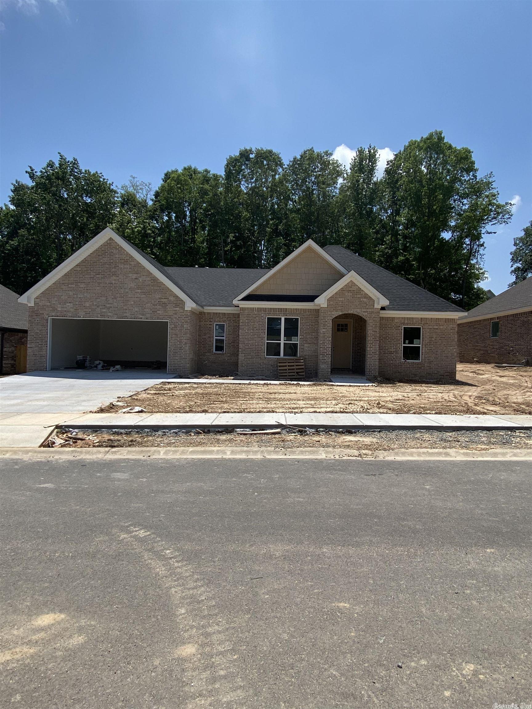 Beautiful New Construction Home located in the new  Roman Heights Subdivision.. Amenities Include: Approximately 2061 SF, 4 Bedrooms ( 4th Bedroom is set up for Office ), 2  Bathrooms, Living Room with gas log fireplace, Open Floor Plan, Kitchen/Dining Combo, Living/Dining Combo, Large Kitchen Island, Split Bedroom Floorplan, Large Custom Tile Shower, Pantry, Laundry Room, LVP Flooring in main areas, Nice Lot, Covered Rear Patio, Covered Front Porch, 2 Car Garage, Bryant Schools, And Much More. A Must See....