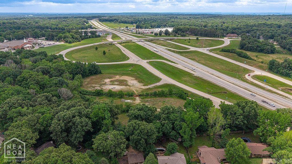 Prime I-555 Commercial Site Across from Walmart Supercenter, approximately 7.85 acres. Positioned at the corner of a major highway on-ramp with approximately 25,000 vehicles per day, this commercial development site offers the visibility, access, and surrounding retail demand developers look for. Located across I-555 from Walmart Supercenter and near established national users including KFC/Taco Bell, Hibbett Sports, and Dollar Tree, the property sits in a proven retail corridor with strong traffic generators already in place. Preliminary site plans have been completed for a multi-unit strip center, making this an excellent opportunity for a developer, investor, or owner-user looking to bring new retail, service, restaurant, medical, or office space to one of Jonesboro's most visible commercial corridors. With highway exposure, on-ramp positioning, and national retail activity nearby, this site is well-positioned for future commercial development.