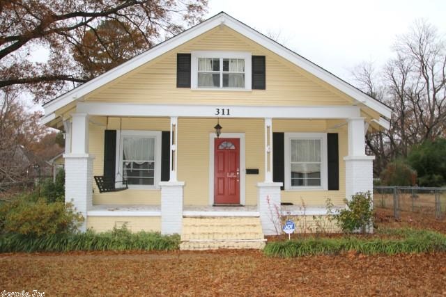 Charming 4 bedroom, 2 1/2 bath Craftsman home across from Central Baptist College. Great front porch with swing. Cozy up to the warm electric fireplace in the living room. Fabulous master suite upstairs with lots of storage and an endless bathroom featuring a great walk in closet.  Separate large laundry room/mud room with half bath off kitchen.  Huge fenced back yard and storage room with electricity.   Home has lots of charm and character on two flat lots. HVAC approx. 3 years old.  Must see!