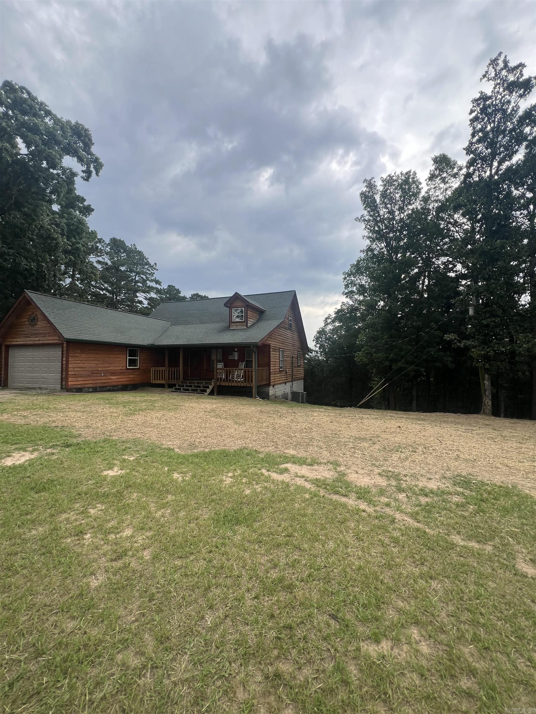 Great custom built home on 1/2 acre close to Greers Ferry Lake.  This 3 bedroom 2 1/2 bath home sits just minutes from Greers Ferry Lake, Little Red River, Short 5 minute drive to Fairfield Bay Marina, 15 minutes to Clinton, just a short drive to Heber Springs or Mountain View on a paved road.  Has a partially finished 640 sq ft basement just waiting for your plans to finish.  Already plumbed for a third full bath and bedroom or man cave.  Sit on the back deck and watch the wildlife and enjoy your coffee.  Come and see this one today.