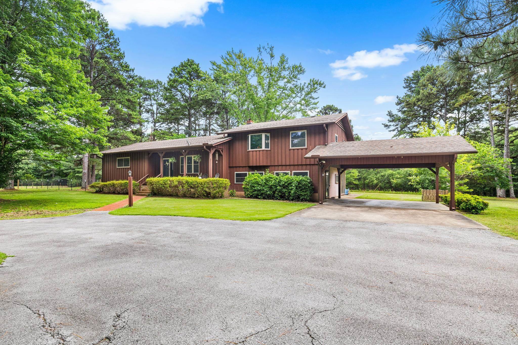 Charming 3-bedroom, 3-bath home on over 3 private acres just 2 miles from the marina and minutes from Greers Ferry Lake and the Little Red River! This peaceful retreat features a bright sunroom, cozy family room with a gas fireplace, and a finished basement perfect for bunk beds, a game room, or additional entertaining space. Whether you're looking for a full-time family home, weekend getaway, or Airbnb investment opportunity, this property offers the ideal combination of privacy, comfort, and lake-area convenience. Dining table and fridge convey at no additional value. *****Please note: The cows and pond visible nearby are not part of the property and belong to neighboring landowners.