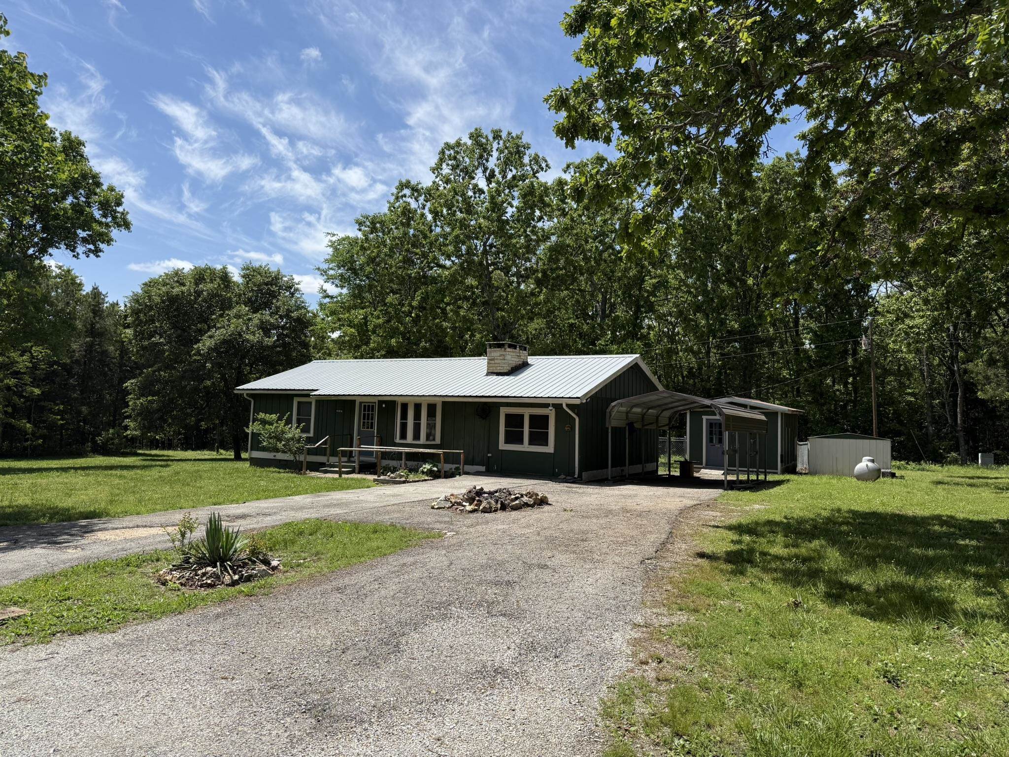 Tucked away in the peaceful setting of Horseshoe Bend, this charming 3-bedroom, 2-bath home offers comfort, functionality, and just the right amount of space to enjoy the outdoors. Situated on approximately 0.7 acres, the property provides a private feel while still being conveniently located near the Turkey Mountain Golf Course. Inside, you’ll appreciate the easy, convenient layout designed for everyday living. The sunroom is a standout feature perfect for enjoying views of the backyard year-round. Step outside to a fenced backyard, ideal for pets, play, or entertaining. The property also includes a one-car carport and a versatile outbuilding with two separate rooms that are great for storage, hobbies, a workshop, or even a home office setup. Whether you’re looking for a full-time residence or a quiet retreat, this property offers a great blend of privacy, practicality, and charm. Give me a call today!