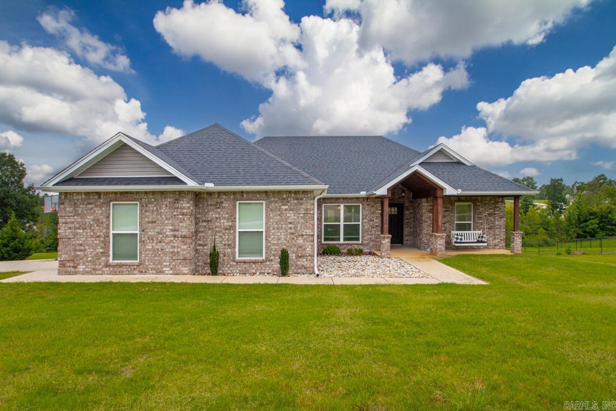 Built in 2021 and sitting on just over an acre (1.07+/-) this beautiful 3 bedroom 2 bath home offers an open concept, tray ceilings in both the living room and master bedroom, luxury vinyl plank flooring throughout the home but both bathrooms have stone tile. The kitchen has leathered granite countertops, stainless steel appliances, and a large pantry. The ensuite has a double sink vanity and a walk-in tile shower. Both bathrooms feature granite countertops. In the backyard, enjoy a covered back patio and a 20x30 shop with electricity and a large bay door. Call today and schedule your showing! EVENING AND WEEKEND SHOWINGS PREFERRED