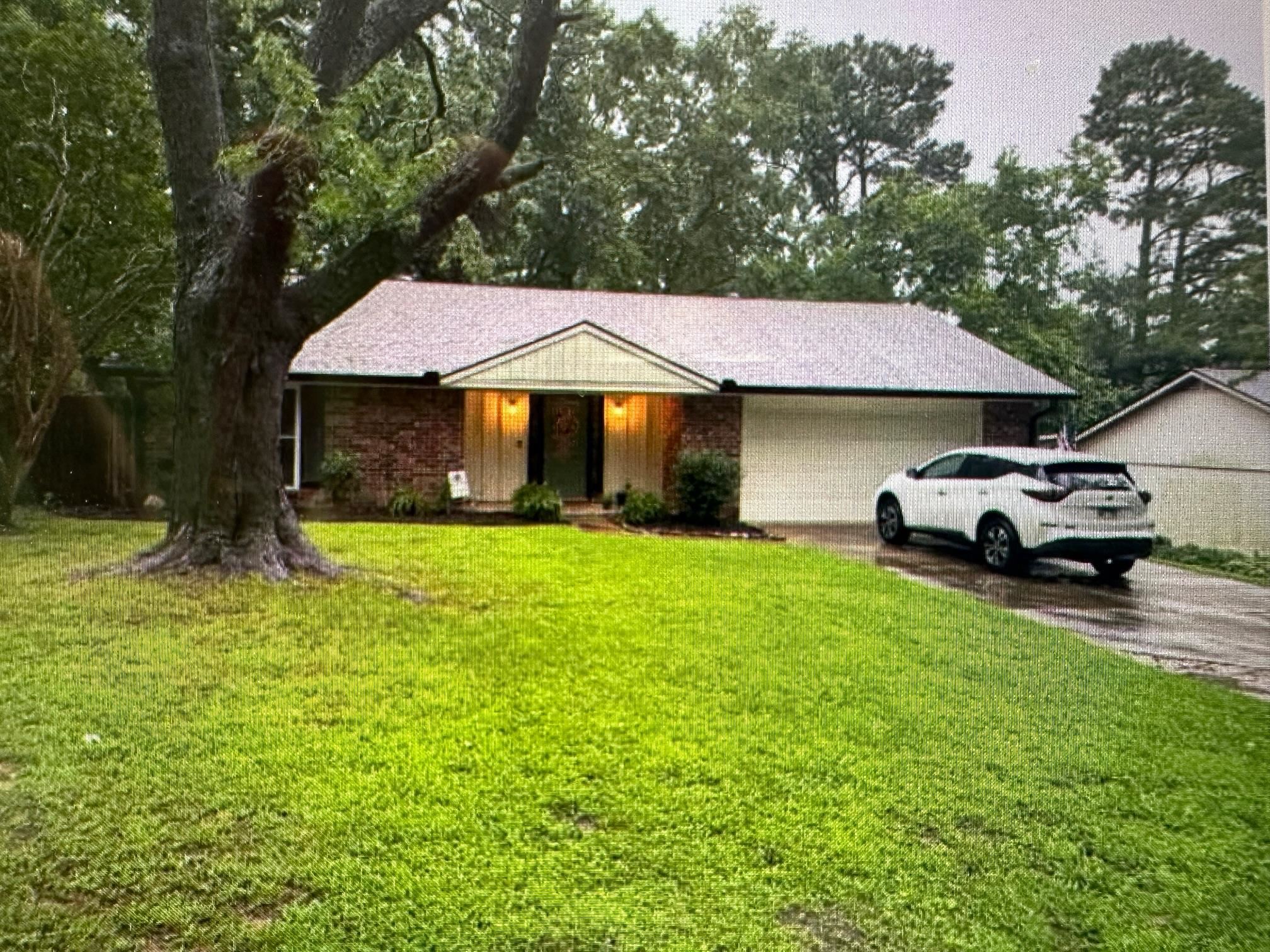Brick 3 bedroom 2 bath home with garage in established neighborhood of Jonesboro, Arkansas.