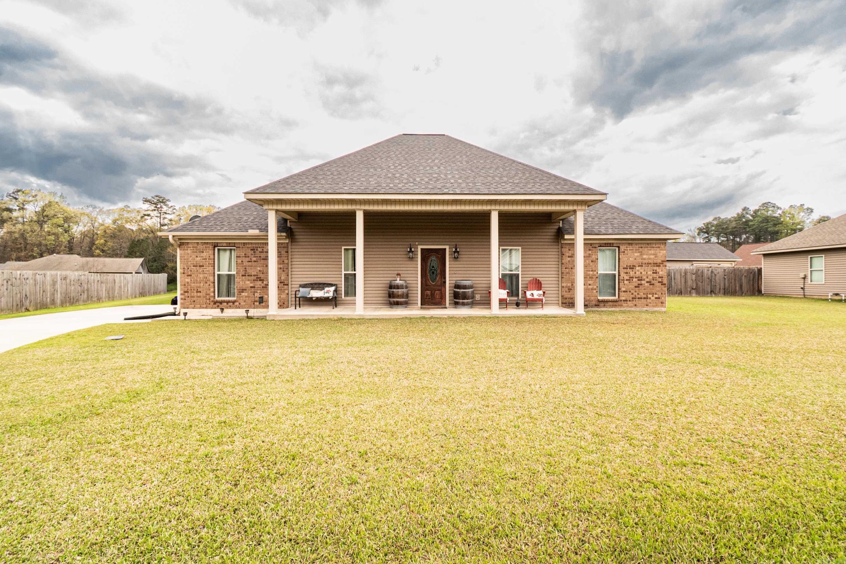 Spacious 3 bed, 2 bath home on a double lot with a huge backyard, conveniently located near the University of Arkansas Monticello campus! This 1,812 sq ft home features an open-concept layout, large living area, and a well-appointed kitchen with plenty of cabinet space. The primary suite offers a big walk-in closet and a relaxing bathroom with soaking tub and separate shower. Covered front porch and plenty of outdoor space make this one a great find.