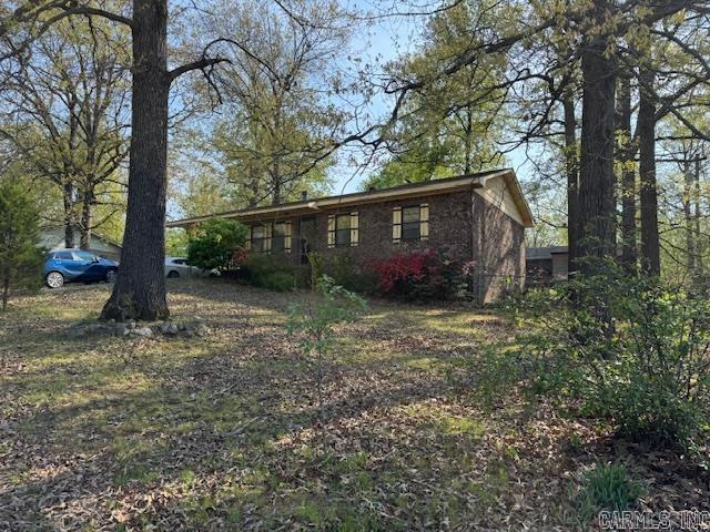 3 BEDROOM HOME ON 1/4 ACRE!  This 3 bedroom, 1 bathroom home has 1152 square feet. Living room-kitchen-dining combo. Office nook off the dining area and a screened in porch. New roof in 2025! Stove, refrigerator, microwave, washer and dryer. Central heat and air. One car carport and fenced in back yard. City utilities. Lot is .27 acres m/l. Home is in an estate and a little rough being sold “as is”. Will not qualify for a government loan.
