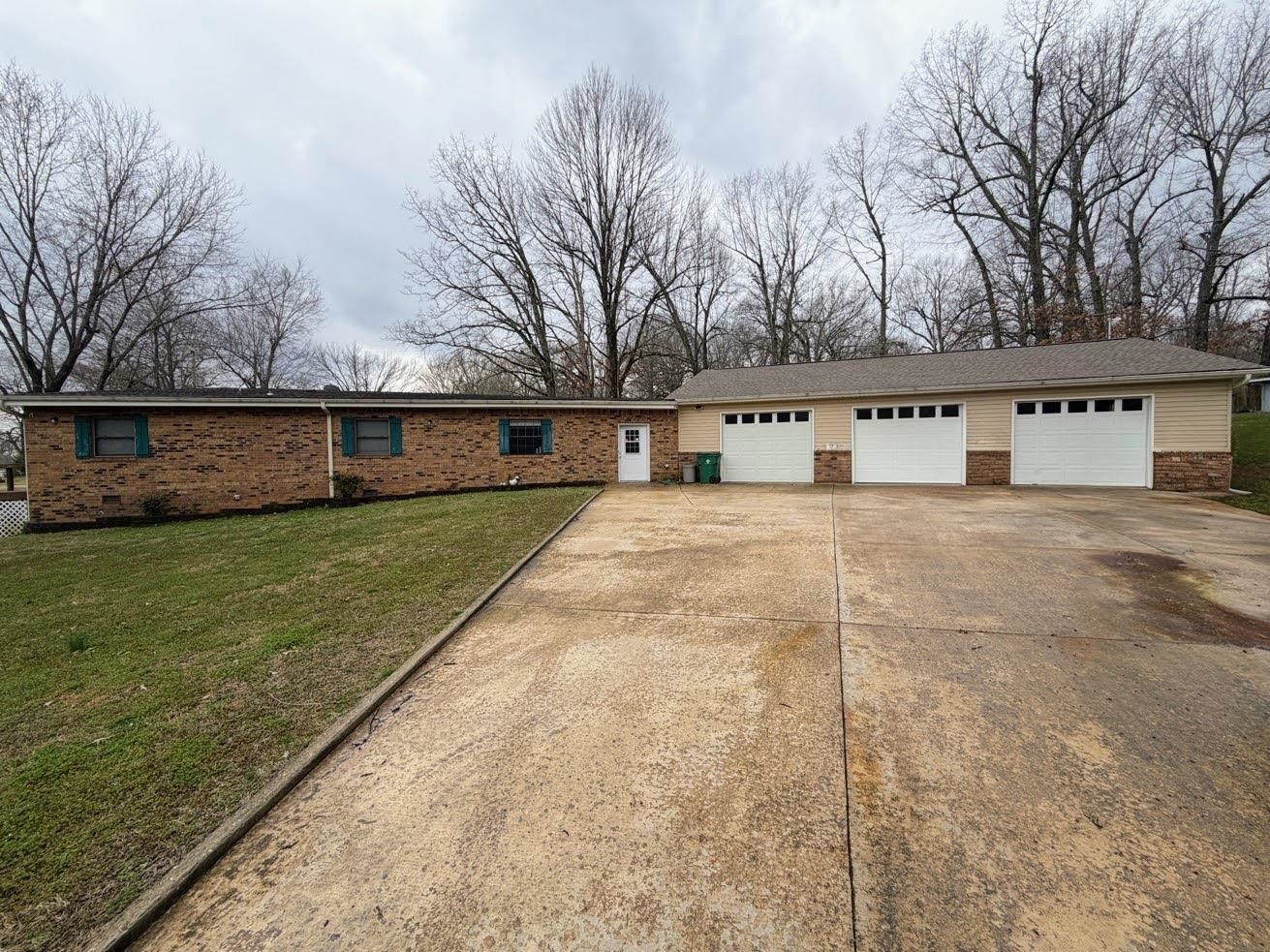 Waterfront! Bring the boat, the cars, the family! Beautiful 3-bedroom 2 bath waterfront home on Crown Lake. Gorgeous floor to ceiling windows and doors to optimize the lake view. Hard wood and carpet thru out. The best thing about this home besides it being one level is there's room for the in laws. There is an attached in-law suite about 700 sq ft. featuring its own kitchenette, 1 bedroom, and bath. The doors coming into the suite are handicap accessible. It's even on its own meter. And can we talk about the garage? It has enough room for 6 full size pick-ups. Three bay doors, an air compressor, and work area. The garage is 44 X 33. Newer roof and heat pumps. Retractable awnings on the deck for shade and the dock is self-leveling with the rise and fall of the water. This home is in its own alcove on the lake. Are you ready to enjoy lake life? Call me today.