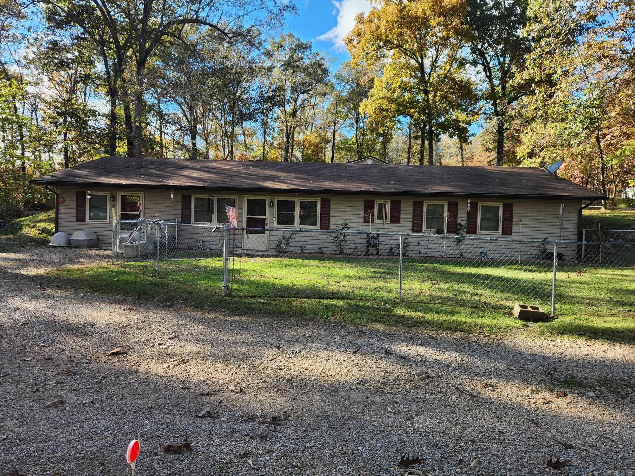 Discover the quiet comfort and remarkable efficiency of this energy-efficient berm home nestled just outside of Flippin near the legendary WhiteRiver. Tucked away in a peaceful setting yet easily accessible off a paved county road, this 4 bedroom, 2 bedroom home offers over 2000 sq ftof living space designed to work with the land not against it. Berm construction means naturals insulation on multiple sides, translating to lowerutility costs and a home that stays comfortable year round. Recent upgrades throughout give this home a fresh, move in ready feel, includingnewer flooring that adds warmth and durability underfoot. The fenced front yard is a standout feature for families with children or pets- a safe,defined space to enjoy the outdoors without worry. With an unrestricted lot, your options are wide open for storage, hobbies, livestock, or simplyenjoying wide-open Ozarks Living. This home checks all the boxes! Call today for showings!