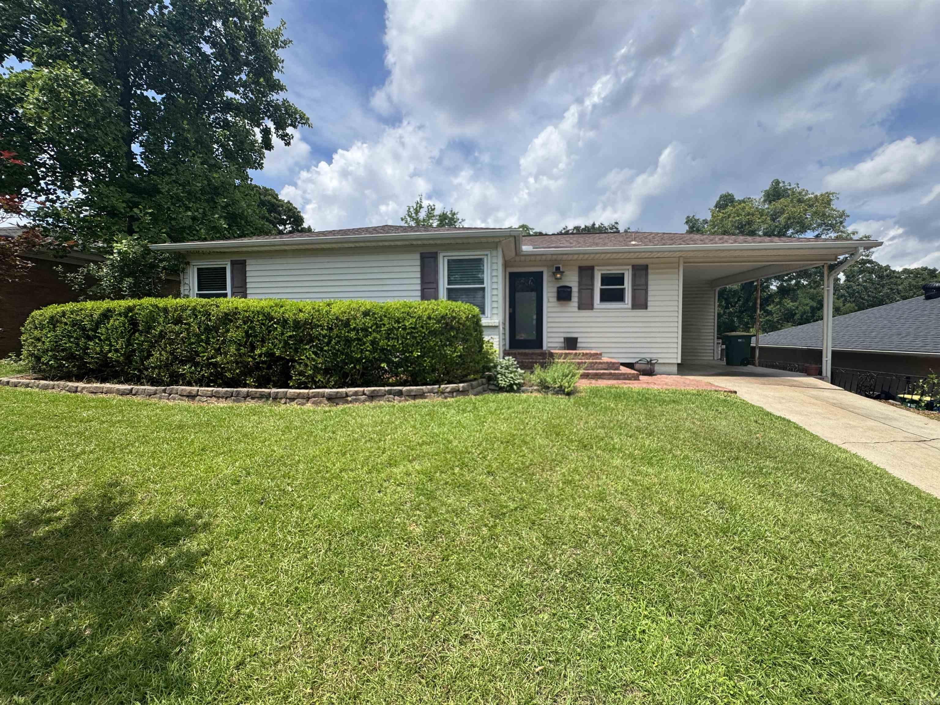 Beautifully updated 3-bedroom, 2.5 bath home in the desirable Park Hill neighborhood! Enjoy two living areas, all-tile floors, custom oak kitchen cabinetry, and numerous upgrades throughout. The spacious primary suite features a large walk-in closet with direct access to the primary bathroom. Recent improvements include a new deck, HVAC system replaced in 2018 (A/C, furnace, evaporator coil, and pad), windows replaced in 2007, and a water heater only 2 years old. The refrigerator, washer, dryer, Vivint alarm panel, and Nest thermostat all convey. A dedicated internet line runs from the house to the detached studio/workshop, which has its own router—perfect for remote work, hobbies, crafts, or a man cave. Additional features include a fixed gun-safe closet and an interior basement that provides excellent storage and serves as a storm shelter during severe weather.The new deck, detached studio, and basement provide substantial usable space beyond the home’s listed square footage. Conveniently located near shopping, restaurants, and interstate access, this move-in-ready home offers comfort, flexibility, and value in one of North Little Rock’s most sought-after neighborhoods.