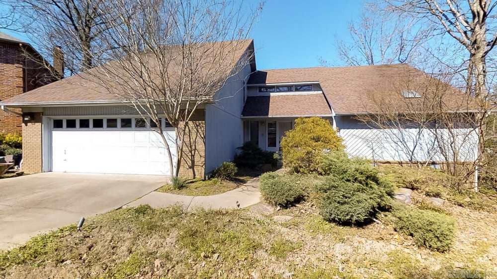 Great Randy Ferguson contemporary. Very open greatroom & dining room with high ceilings, bar & fireplace; kitchen is open to the sun room which looks out over the back. Master BR is on the main level with large bathroom; upstairs is a bedroom, a private bath & 2 other bedrooms which share a bath. Wood floors in the greatroom, dining room & master BR. Potential -creativity, paint brush & a roll of carpet for upstairs & you will have an awesome new house in the wonderful St. Charles neighborhood. (sold as-is)