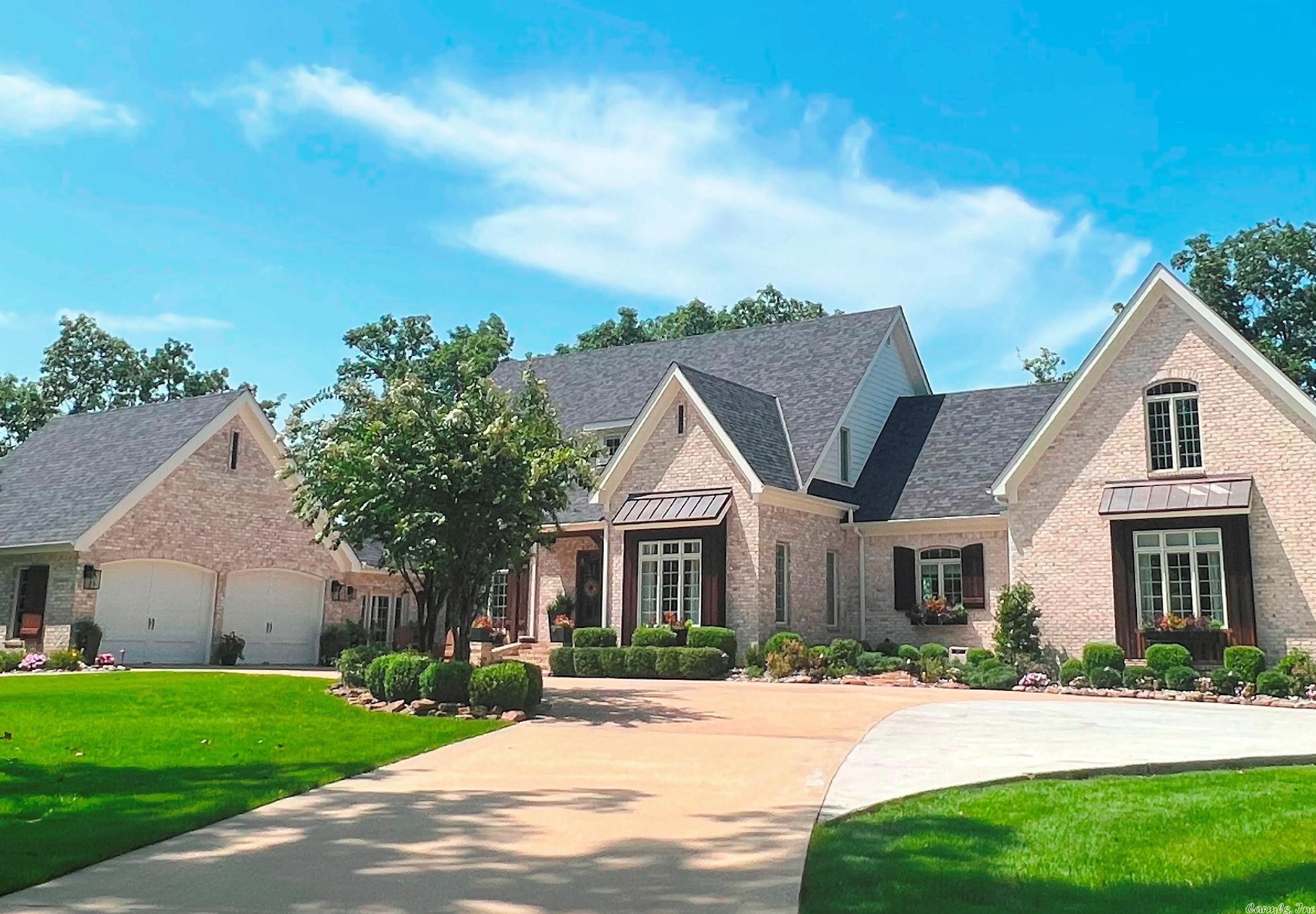BEAUTIFUL GATED ESTATE features CUSTOM BRICK HOME w/SPRING RIVER VIEWS 6.26 AC m/l. HEATED SALT-WATER POOL. 2-car attached garage & 3-car detached garage-shop w/floored attic. 10' ceilings on main floor, 9' on 2nd floor. High vaulted ceiling in family rm & foyer. Auto gate w/solar powered operator. 2 master suites on main level. Site finished oak hardwood LOBA finish. Custom kit cabinets-quartz & granite countertops, butler's pantry, BIG laundry rm. Motorized shades in great rm. Supplemental info available