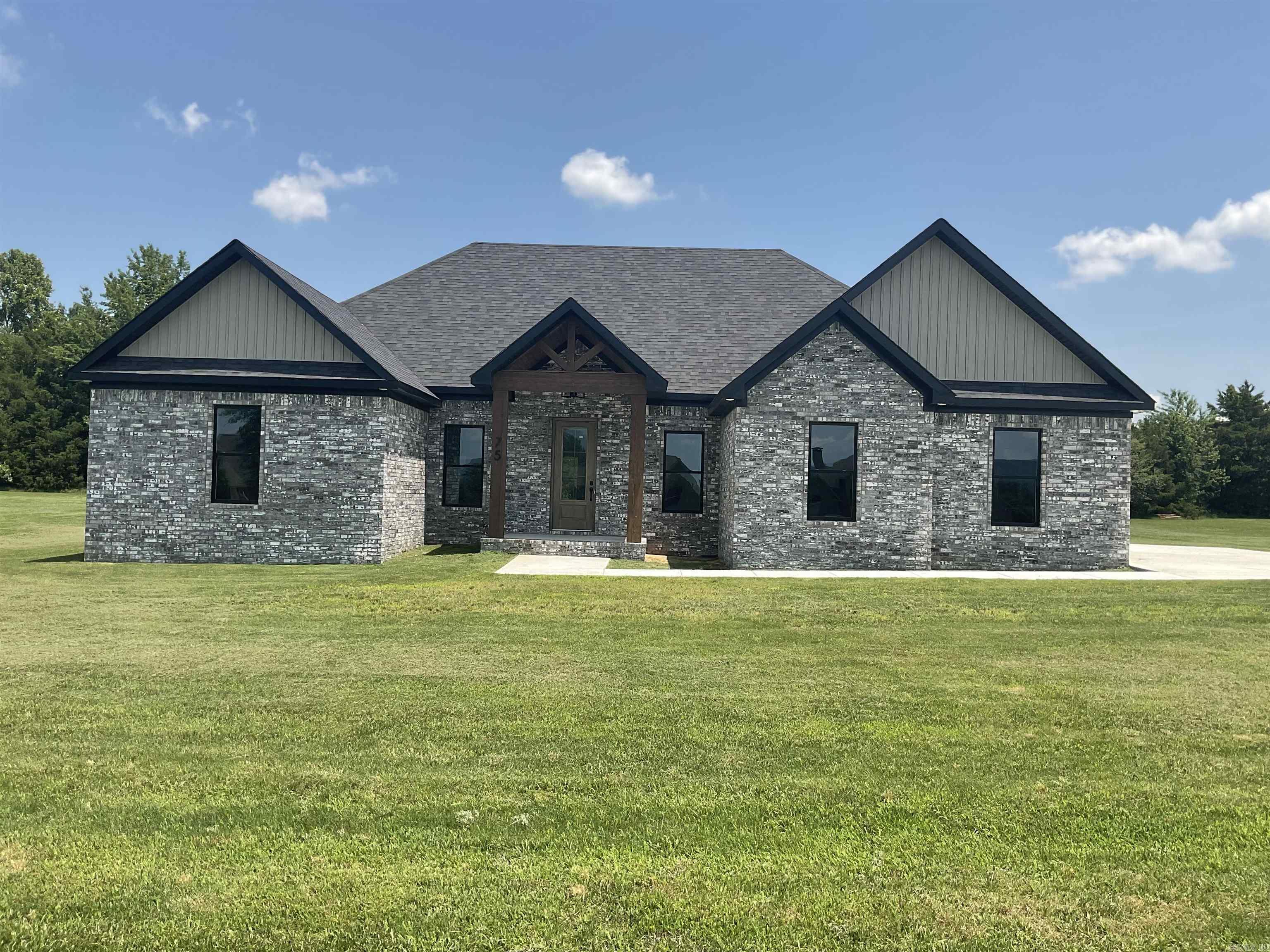 NEW CONSTRUCTION AT GREERS FERRY LAKE AWAITS YOU.  What a pleasure it's going to be pulling into the driveway of this well built home located across the street from the lake with a view of Greers Ferry Lake.  Enjoy your peace & safety with the gated entrance into this prestigious neighborhood.  Only a short golfcart ride to Shiloh Marina & even shorter ride to the neighborhood launching ramp that backs into Hurricane Creek across from the Narrows. The home is clean & crisp with a wonderful master suite featuring walk-in closet/make-up vanity, W.I. shower with double shower heads & seating. Laundry room has access to master W.I. closet & bath as well as hall entrance. Luxury flooring, double ovens, built-in micro, tons of counter space/cabinets/drawers, 5 burner gas top range, whirlpool appliances ceiling fans thru-out, Split BR floorplan, makeup vanity with tub/shower combo guest bath and a covered patio with gas line for grill.  Tankless water heater, radiant barrier roof sheating (30 degree cooler diff.) class 3 impact shingles for hail & wind are other great features.