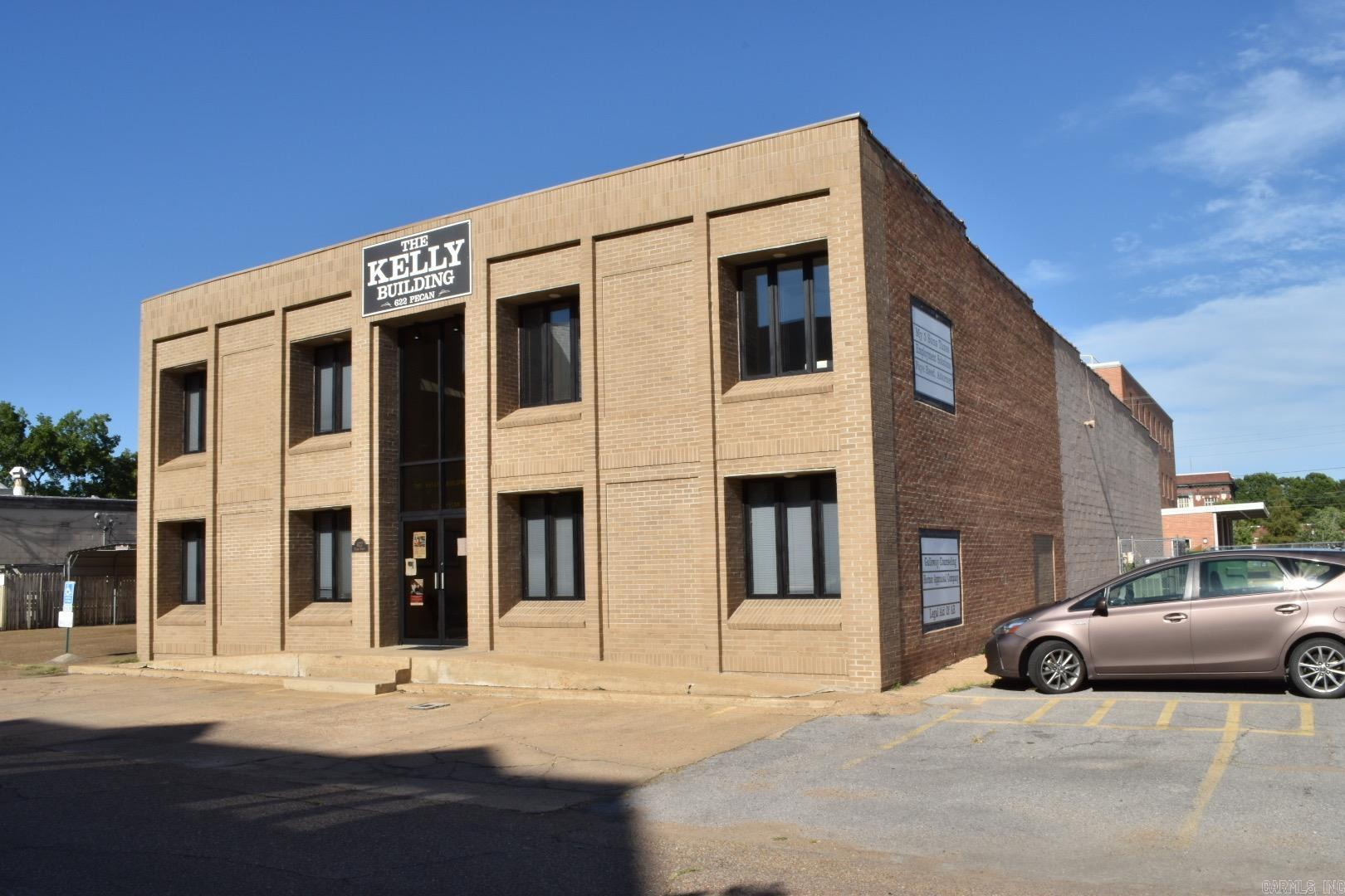 This two-story office building, in the heart of downtown Helena, offers 5,000 square feet of combined office space and an additional 2,800 square feet of warehouse space. Situated near the post office, the courthouse and many essential businesses, with easy access and good visibility, the location is second to none! Ten of the 17 individual offices are currently rented. Warehouse is not currently rented. Annual income would increase if all offices and warehouse were leased. Office space is carpeted throughout, and most of the furniture will convey. Front office windows have views of the the adjacent museum and churches with lots of natural light. Building is equipped with central heat and air and newly installed fiber optic phone and Internet. Ample parking space with easy access to the entrance. Please contact listing agent to show. Agents see remarks.