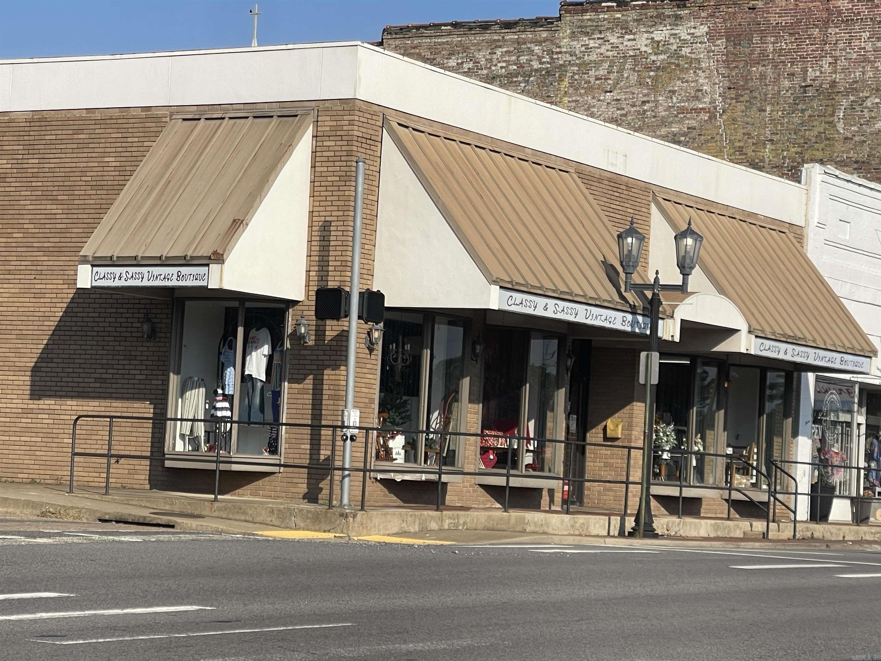 Prime downtown location in the heart of Malvern's business district with good visibility and accessibility.  Property updated in 1991; see architectural plans at the building.  Upper level expanded (~ 687 sq. ft.) after 2000, with plumbing and electrical for kitchen, shower, sink and toilet. Even space for a bedroom and storage. Downstairs has a lounging room and space for a washer and dryer.  This adds mixed-use potential (retail downstairs + residential loft upstairs), which can appeal to owner-users or investors seeking extra income from living quarters.  Recent upgrades: Two new heating and cooling units (2023, $18,800 cost) for 2-zone climate control, improving comfort and reducing immediate buyer costs.   In early 2024, the lighting fixtures were transitioned to energy-efficient LED lighting in the main 16-foot retail space. No monthly maintenance!