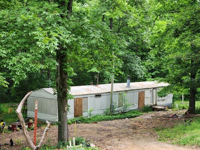 Discover the potential of 19349 Eugene Road, a property situated in a peaceful area of Harrisburg, Arkansas. While the mobile home on-site holds no value, this property offers a blank canvas for your future plans, whether you're looking to build your dream home or invest in a project with great potential.
