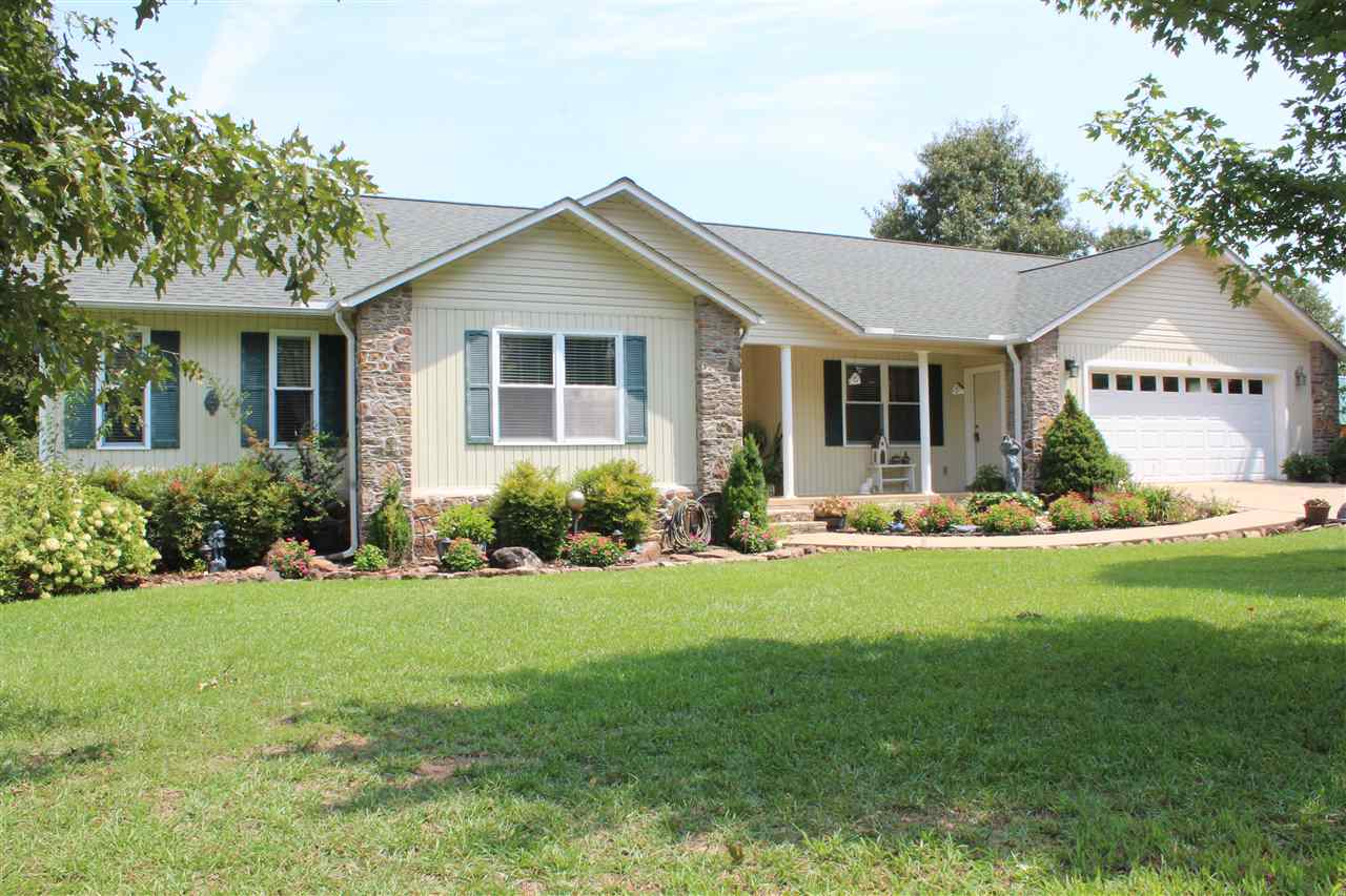 Immaculate condition, this home Features 3br, 2ba,large kitchen and dinning area, with extra cabinet storage. Beautiful hardwood floors Gas fireplace.Master bedroom is large with walk in closets & master bath double sinks, shower & Jacuzzi tub. Beautiful designed landscape, Very well maintained home. It Boosts an Oversize Garage in this home makes great for covered parking and a ton of storage, Glass and screened in room for watching sunsets. Close to the heart of Greers Ferry & the LAKE! This is MUST SEE!