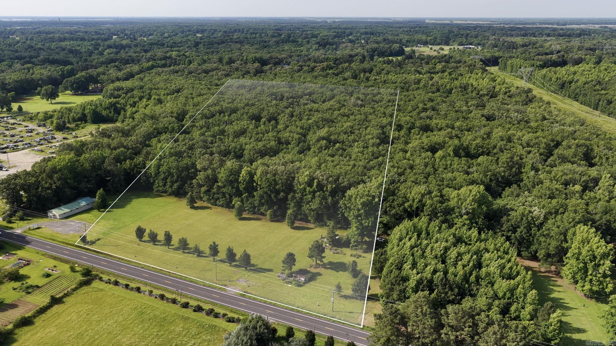 Escape to the country without leaving it all behind. Tucked along AR-294 in Jacksonville, these 9 acres offer the rare blend of room to roam and easy access to everyday life. Picture your future home rising from the ~3 cleared, level acres out front—a ready-made building site where your foundation could go in tomorrow. Behind it, ~6 wooded acres wrap your future in privacy: a buffer of mature trees, space for trails, a workshop, a garden, or simply quiet mornings on the back porch. Imagine summer evenings on land that's truly yours, room for kids and dogs to run, and the freedom to build exactly what you've been dreaming of. Commuters love the location—just minutes from Cabot and Little Rock Air Force Base, with shopping and schools close by. Bring your builder, your blueprints, and your vision. Opportunities like this—cleared, accessible, and ready—don't come along often.