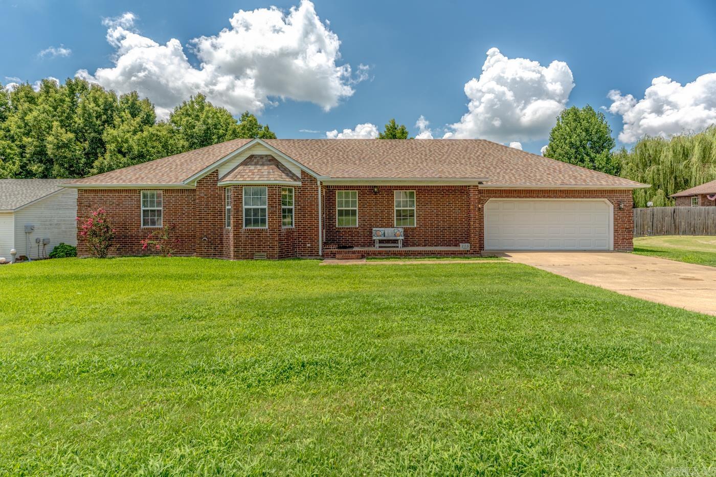 Don't miss this opportunity! This all-brick home features a finished basement and a 20' x 30' (+/-) detached shop complete with electricity and a mini-split system. The main level offers approximately 1,882 +/- sq ft with a split-bedroom floor plan. The primary suite includes a private bathroom and walk-in closet, while the guest bathroom, two additional bedrooms, each with double closets, are situated on the opposite side of the home.The spacious eat-in kitchen is equipped with a large breakfast bar island, abundant cabinetry with display shelving and French doors that open to the partially covered back deck. Just off the kitchen, the living room features an eye-catching octagon tray ceiling and beautiful bay windows. The generously sized laundry room includes a utility sink and a storage closet with built-in shelving.The versatile space in the basement adds 650 sq ft +\- Area used for an office, walk-in closet, and the flexibility of space to serve as a fourth bedroom or recreation area. Additional highlights include a large storage room within the attached two-car garage. See if this could be your next home—schedule a tour or request a video tour today!