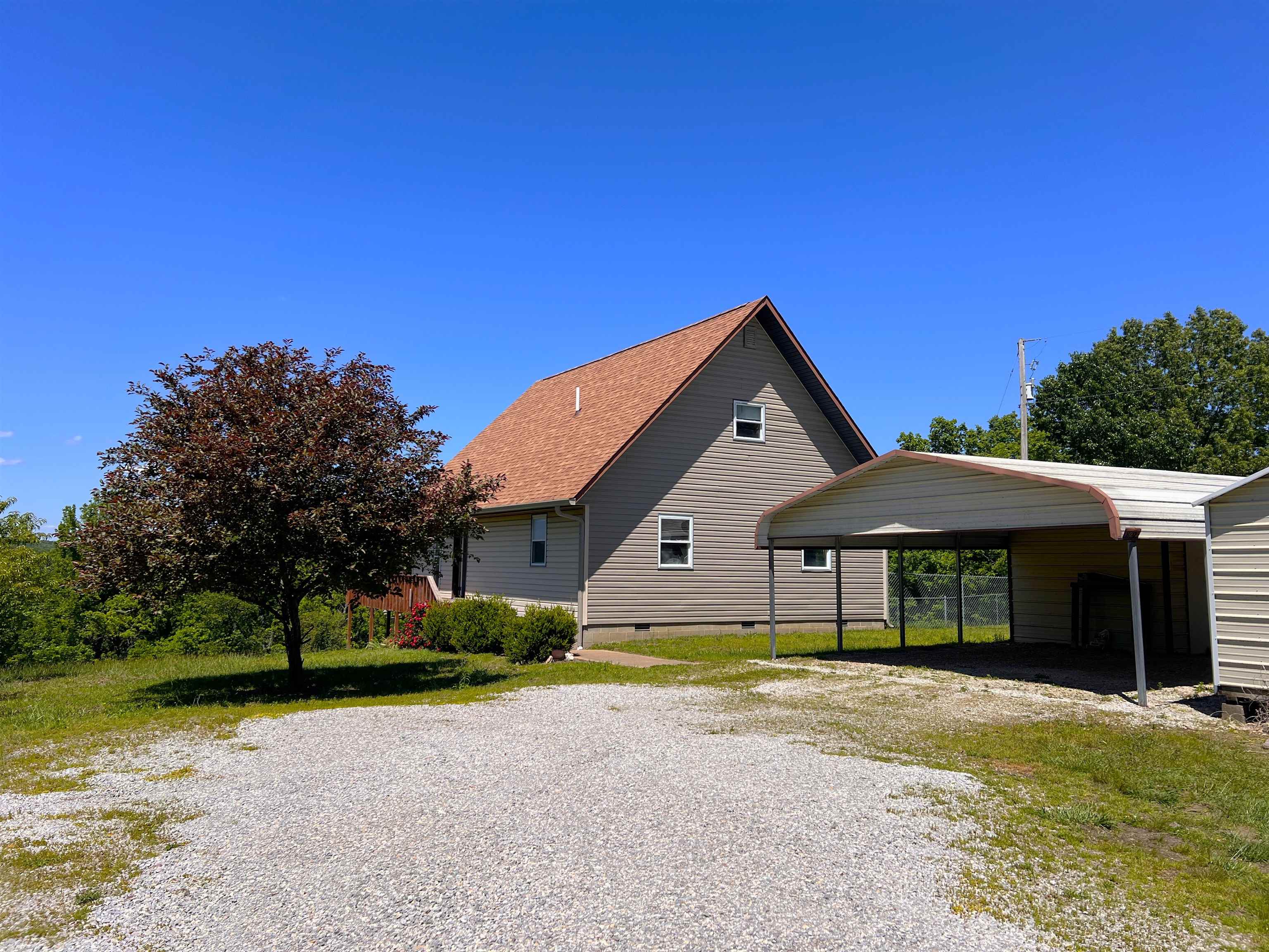 Nestled in the beautiful Ozarks of Stone County, this 3BR/2.5BA home on approximately 10 acres offers peaceful mountain views, privacy, and plenty of potential. With good bones and a functional layout featuring two full baths downstairs plus a spacious upstairs area with half bath, this property is ready for someone to bring it back to life with a little elbow grease and personal touch.  Enjoy year-round scenery from the screened-in back porch overlooking the mountains. The property also features a fenced side yard, fruit trees, carport, storage building, and room to enjoy quiet country living. Refrigerator, washer, dryer, portable dishwasher, and microwave all convey.  Some cosmetic updates and upstairs flooring are needed, and pricing reflects the opportunity to make this Ozark property your own. Conveniently located near Mountain View while still offering the peaceful country feel buyers love. Call today to schedule your private showing and see the potential this property has to offer.