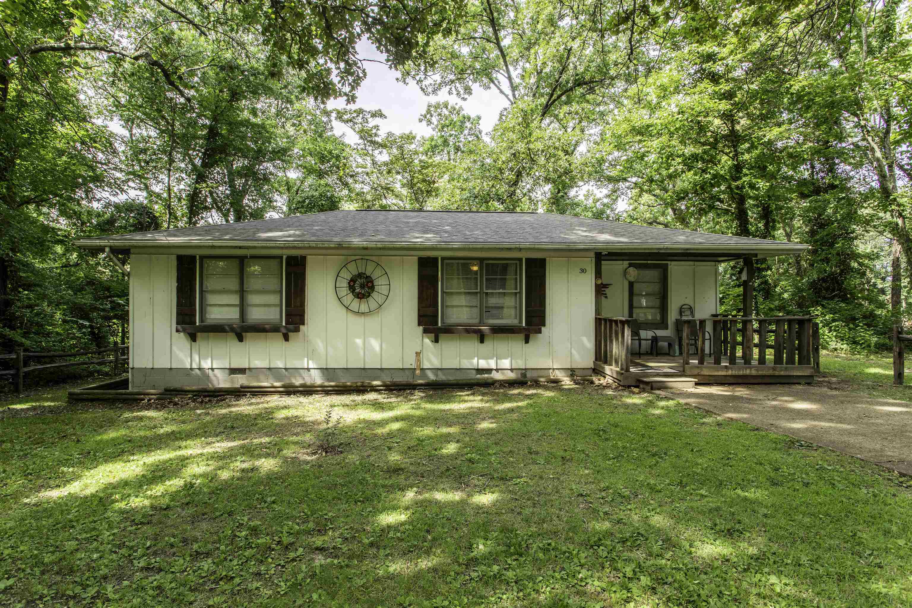 Recently Remodeled 3-Bedroom Home with Custom Features & Historic Character  Move-in ready and full of charm! This beautifully updated 2020-built home offers 3 bedrooms, 1 bath, and a blend of modern convenience with unique historic character. The spacious custom bathroom provides a luxurious feel, while newer flooring, 6-panel interior doors, and a stunning wood ceiling in the kitchen add warmth and style throughout.  The kitchen comes equipped with stainless steel appliances and features custom barn wood accents reclaimed from an 1880s tobacco plantation, creating a truly one-of-a-kind space. Entertain guests at the custom-built bar or step outside and enjoy two custom-built decks perfect for relaxing or gathering with family and friends.  Recent improvements include a dependable TRANE HVAC system for year-round comfort and a brand-new roof installed in 2026. From the thoughtful updates to the distinctive reclaimed wood details, this home offers character you simply won't find in newer construction. Whether you're looking for a primary residence, weekend getaway, or investment opportunity, this property is ready for its next owner to move in and enjoy. Selling with most furniture