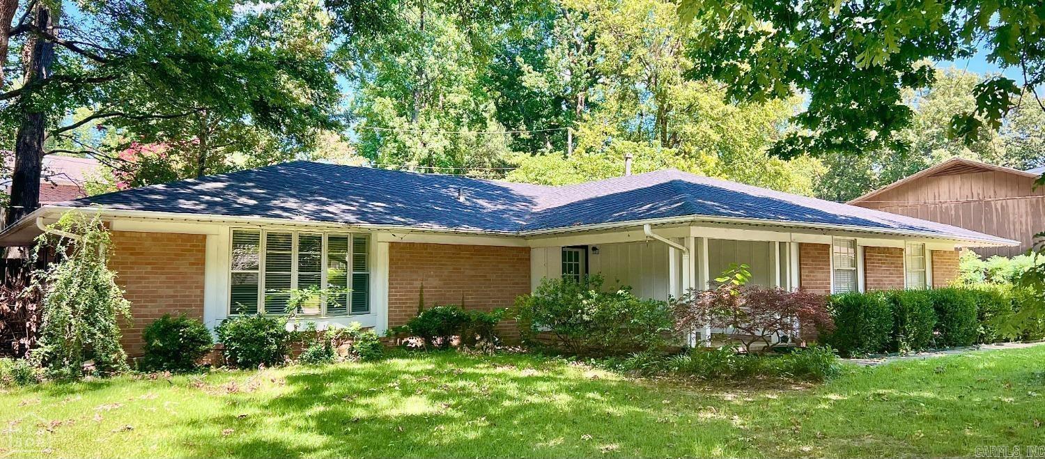 Welcome to this charming 3-bedroom, 2-bathroom house. This property offers a fantastic opportunity for those seeking a comfortable and well-maintained home in a mature neighborhood. Upon entering, you'll be greeted by two spacious living areas, one of which features a beautiful brick fireplace and built-in shelving, perfect for cozy evenings with loved ones. The formal dining room boasts a servery window that conveniently connects to the kitchen, making entertaining a breeze. Speaking of the kitchen, it showcases neutral-colored cabinets with a tea stain glaze, giving it an elegant and timeless look. The 6-burner Thermador gas cooktop is sure to delight any aspiring chef. With a size of 2242 square feet, this home provides ample space for your family's needs. Step outside into the private backyard where you'll find shade trees providing the perfect spot for relaxation. Situated in a peaceful neighborhood, this property is close to everything you need. Whether it's shopping centers, restaurants, or recreational facilities, you'll find them all within easy reach. Don't miss out on this wonderful opportunity to make this house your own.