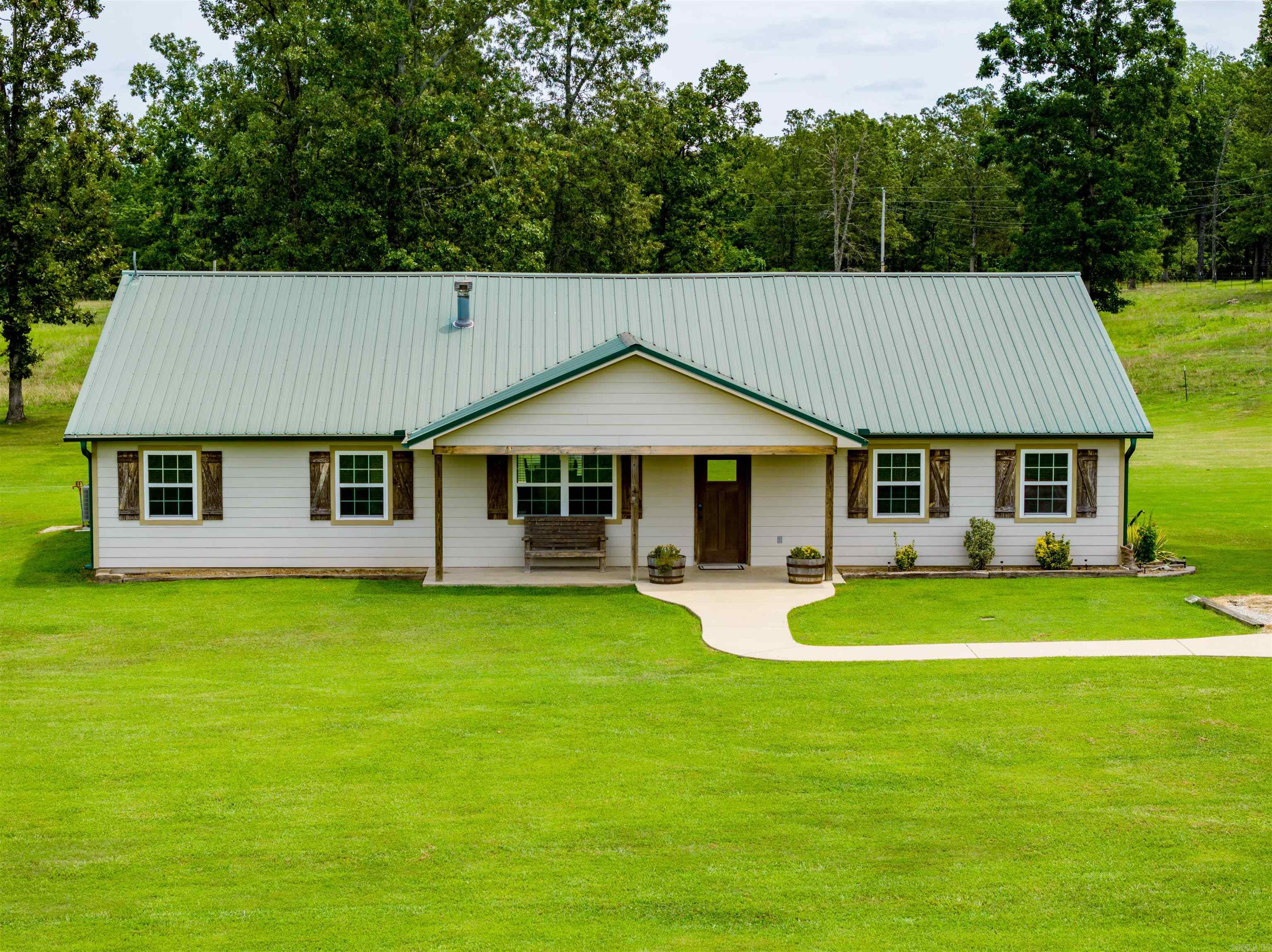 165 +/- Acre Cattle Ranch!This ranch is a very well-manicured farm with about 80 acres of pastureland, some of which are used as hayfields, and the remaining acres are made up of a mixture of hardwoods.Woods have a firebreak around them.The property is fenced, cross-fenced, with two ponds, a 30 by 36, 5 stall barn with a feed room and a rollup door, multiple working coral setups, and every field has a freeze-proof water tank with a shutoff valve.This makes working cattle and managing cattle run smoothly.  Fields have been fertilized and sprayed yearly with trails throughout the farm so that you can drive anywhere on the farm at any time of the year!When you enter the gate off the main road, you will return to the house, where you sit off the road looking over the gorgeous pasture and a pond!You will see the house and the shop.This home was built by the seller in 2012 and has a metal roof, concrete board for siding, gutters, stone countertops, Next (FIBER Internet), NAEC Electric, and a Well for water!With 5 bedrooms, 2 full baths, a large living room, laundry room, dining room, and that nice open kitchen with a eat at bar, two porches, and views!Guest house,1 bed 1 bath, with shop.