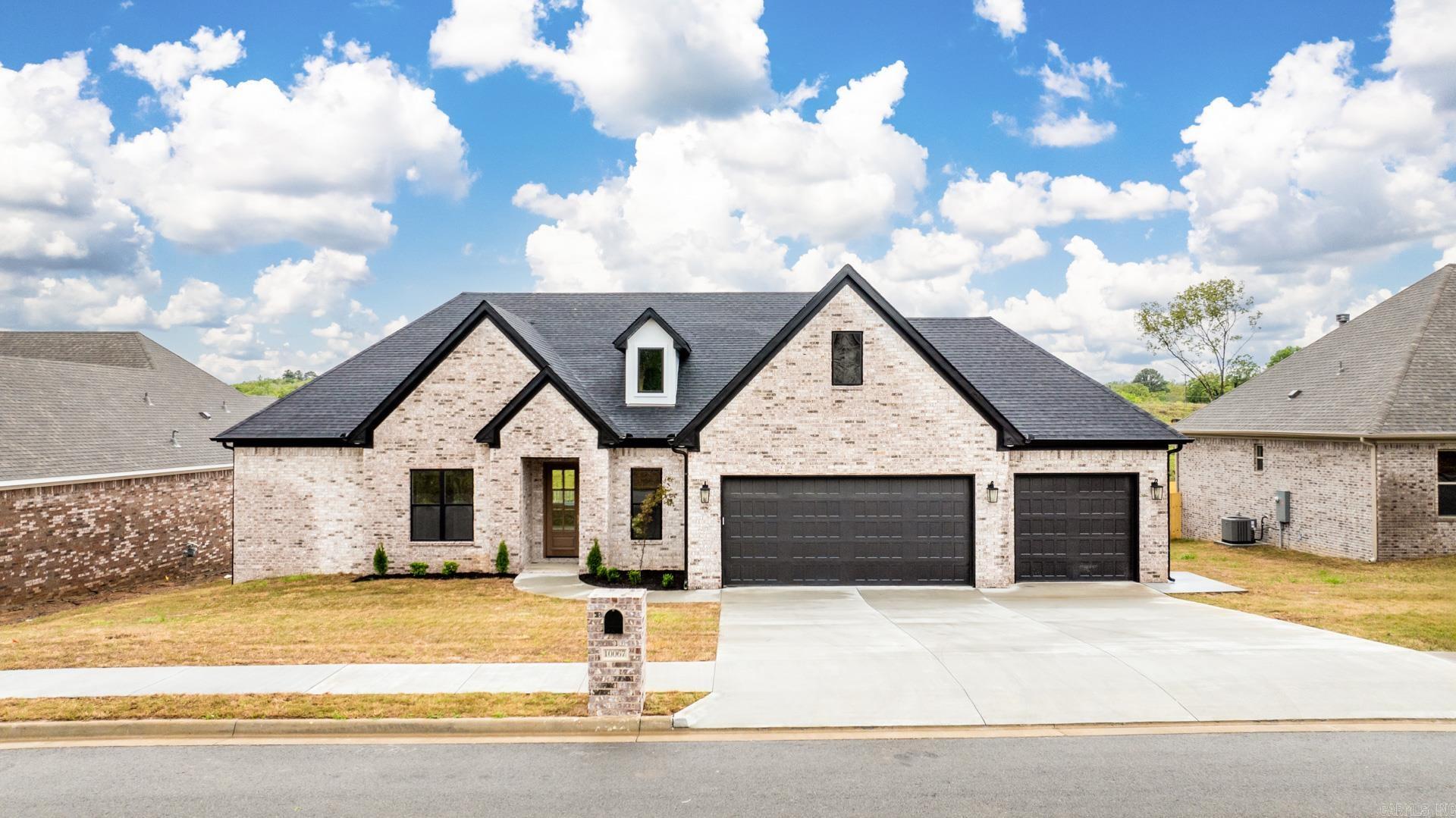 Nestled in the highly sought-after Miller Heights subdivision in Sherwood, AR, 10067 Hidden Circle offers an exceptional blend of luxury and comfort. This home features 4 spacious bedrooms, a separate office, and 3 elegant bathrooms. The gourmet kitchen includes granite countertops, stainless steel appliances, custom cabinetry, a gas stovetop, wall oven, and a huge walk-in pantry. The open-concept living area features hardwood floors, tall ceilings, abundant natural light, and a cozy fireplace, flowing seamlessly to the outdoor living space and fully fenced private backyard. The completely flat backyard, a rare find for the area, is also one of the largest in the subdivision, offering ample room for entertaining, play, or relaxation. Walk-up stairs lead to a massive attic with exceptional storage space and exciting potential for future customization. Additional highlights include a 3-car garage with custom mud benches and a luxurious primary suite with a soaking tub and walk-in shower. Conveniently located near premier schools, shopping, and dining.