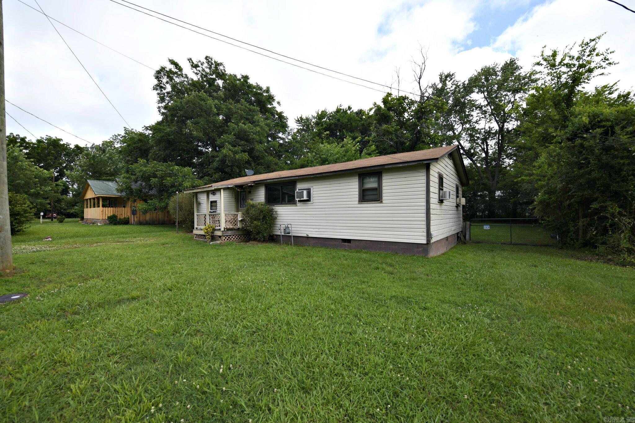 Enjoy town living with easy access to recreation in this 3 bedroom, 2 bath fixer-upper in Mena, Arkansas, perfectly positioned for buyers who want in-town convenience plus outdoor adventure. Centrally located for a short drive in either direction for recreation, this affordable home offers a nice floorplan ready for your repairs & updates, with space to create a cozy primary suite, guest rooms, and open living area to fit your lifestyle. This Mena AR property is ideal for cyclists, runners, and families who love being outside but also appreciate the comfort of living in town near shopping, dining, and schools. With some repairs and cosmetic upgrades, this fixer upper has great potential as a year-round residence, starter home, or long-term rental in a desirable small-town location. If you’ve been searching for “Mena Arkansas recreational home in town,” “house near bike trails Mena AR,” or “Mena AR fixer upper close to outdoor recreation,” this property checks all the boxes for town-and-trail living.