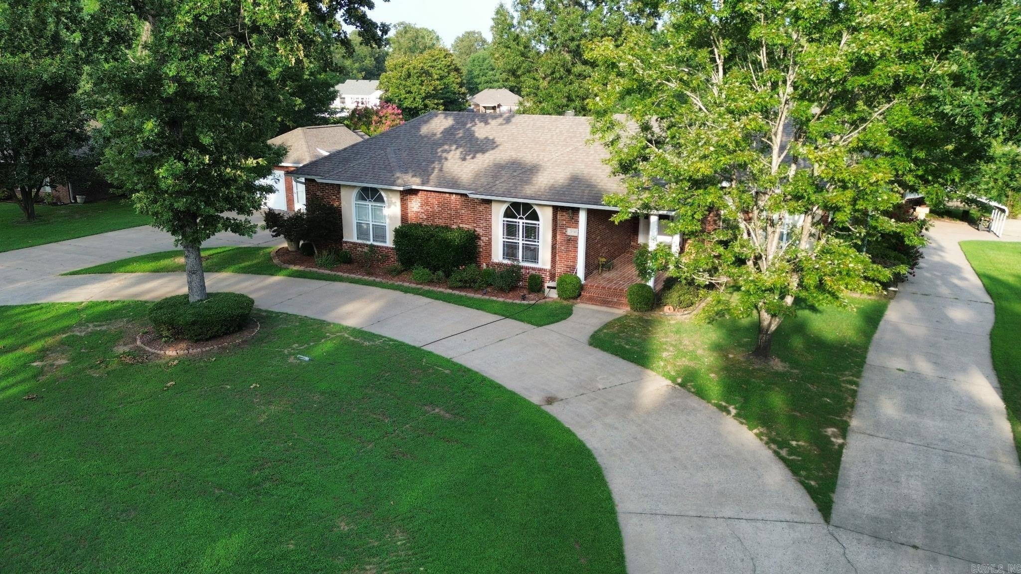 **WOW**Spectacular 3700 sf brick home sitting on private lake**Lakeview with your own covered dock**In-ground pool**Poolhouse with full bath**Covered porch overlooking pool is great for entertaining**5 BR's, 4 BA's**Large master suite features recently updated master bath with walk-in closets, walk-in shower, soaking tub and flooring**2 of the bedrooms & 1 bath are located on lower level which also has a living room w/electric FP, kitchen/dining area, laundry room, & walk-in closet that doubles as a Safe Room**Lower level has it's own driveway, carport and private entrance**Fabulous in-law qtrs or would be a great rental unit**Sheridan Schools but only 10 minutes to downtown Little Rock**