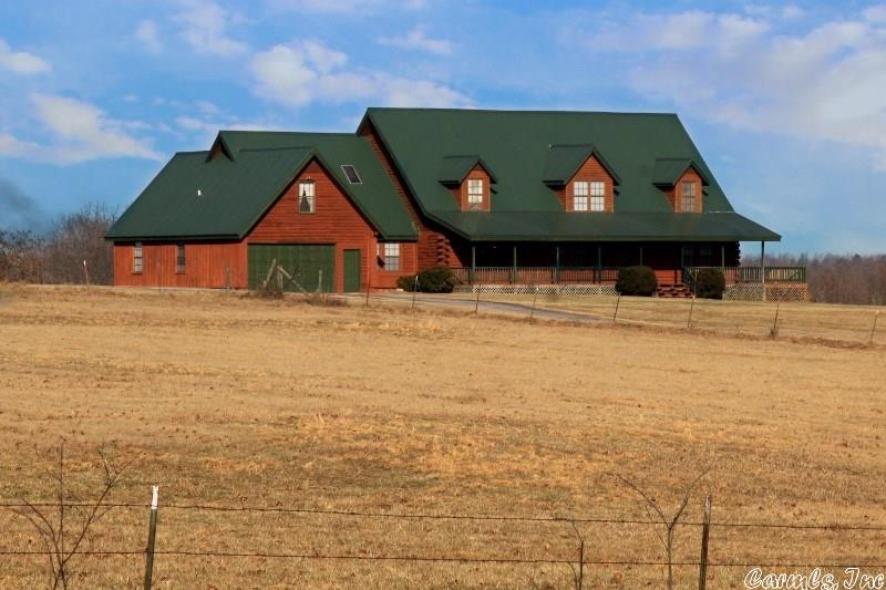 LOG HOME ON 5 ACRES M/L:  This massive, log and wood siding 7 bedroom, 4 bathroom home with attached 2-car garage has approx. 4900 sq ft and 5 manicured acres m/l on a paved road close to shopping and local amenities.   Some of the many features include vaulted beamed ceilings with recessed lighting and skylights, new stainless steel appliances, large master suite with private bath and walk-in closet. Great “man cave,” office, or bonus room on the main floor as well.  Priced to sell!