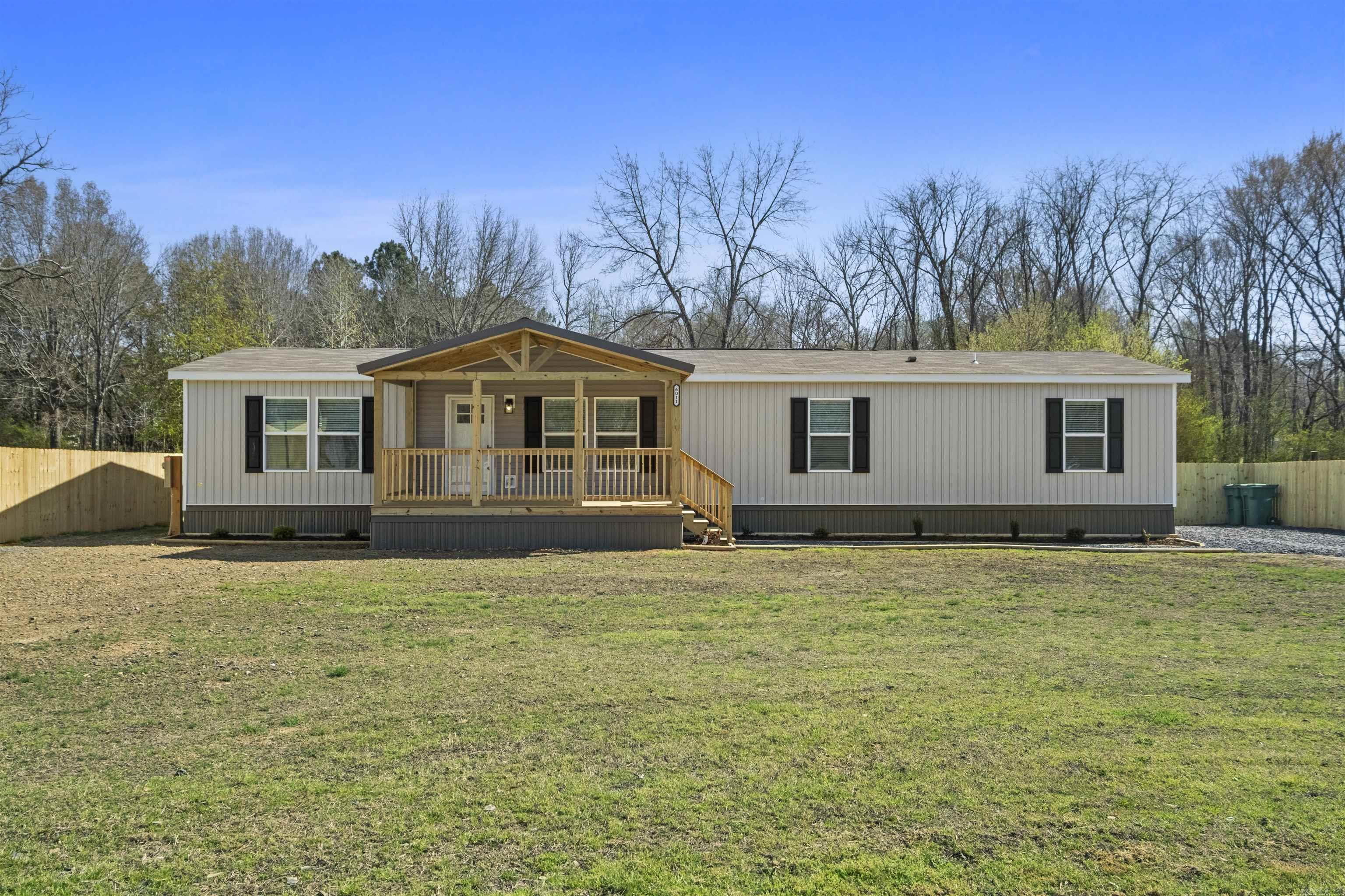 Country Living at its finest. New Construction 1904 sq. ft. home with roomy front and rear covered decks on .69 acre. Home is just minutes from the back gate of the Air Force Base. Open concept layout with split floor plan and plenty of room for a growing family. Great kitchen space with island and plenty of cabinet space. Everything on this property is brand new from the fences to the septic system. Exceptional en-suite primary bedroom with huge closet, walk-in shower, soaker tub, and dual Koehler vanities. Tons of space for the kids and fur babies to run and play.