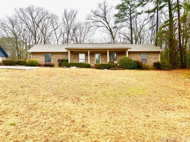 Welcome yourself home to this traditional brick home with inviting front porch.   This 3BR/2BA home has a lot to offer new owners, sought after neighborhood, desirable floor plan with split bedroom arrangement, built-ins, wood burning fireplace in living room, formal dining room, screened-in deck, 2 car-carport with storage on side, extra parking pad and shed with water and electrical to it.    Improvements: New Ceiling in Living Room & Kitchen 2020, New paint inside and out 2020, New Roof June 2021, New Water Tank October 2022, New Central Air Unit November 2015, electrical is hard wired for a generator.  This charming home is a must see!
