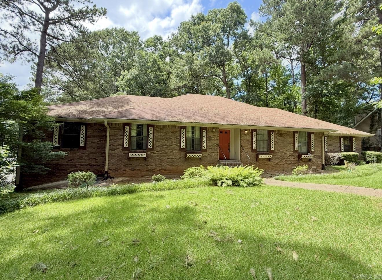 Spacious Family Home in a Fantastic Location! Room to live, grow, and spread out in this 6 bedroom, 3 bathroom home located in a great neighborhood in Arkadelphia. Situated on a large corner lot, this property offers space both inside and out! The flexible layout is perfect for large families or multi-generational living. The lower-level functions beautifully as mother-in-law quarters, complete with its own kitchen and living space, giving privacy and independence while still being under one roof. Upstairs features generous living areas and bedrooms, plus a fireplace that adds warmth and character to the home. Just off the main garage, you’ll find a dedicated workshop space, and there’s an additional downstairs garage/workshop, making this property ideal for hobbyists, storage needs, or anyone who needs extra functional space. Homes with this much square footage, versatility, and location don’t come along often — a true opportunity to make it your own in one of Arkadelphia’s most desirable areas.
