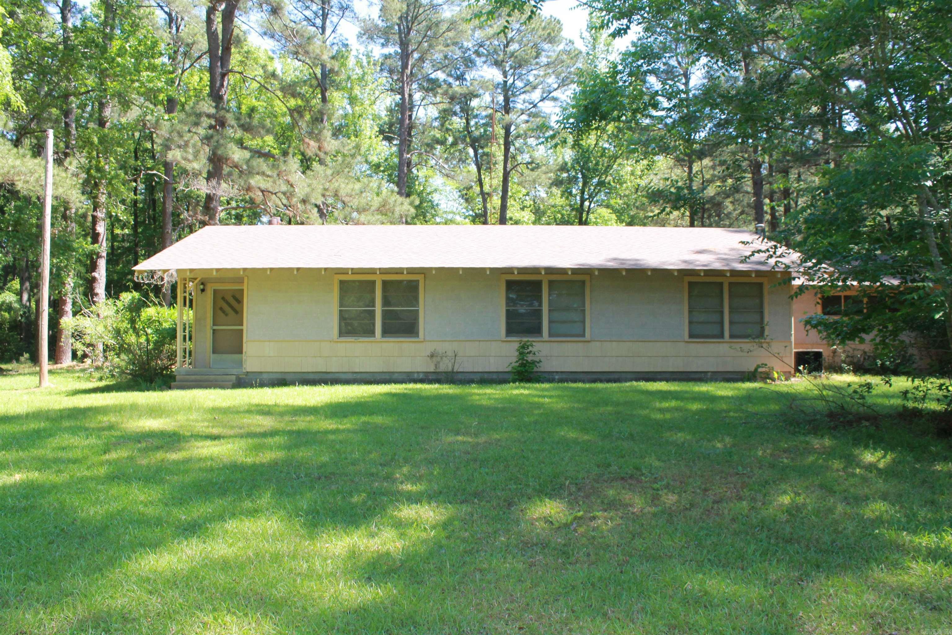 Country living just out of town situated on 6.54 Acres. HOUSE TO BE SOLD AS IS